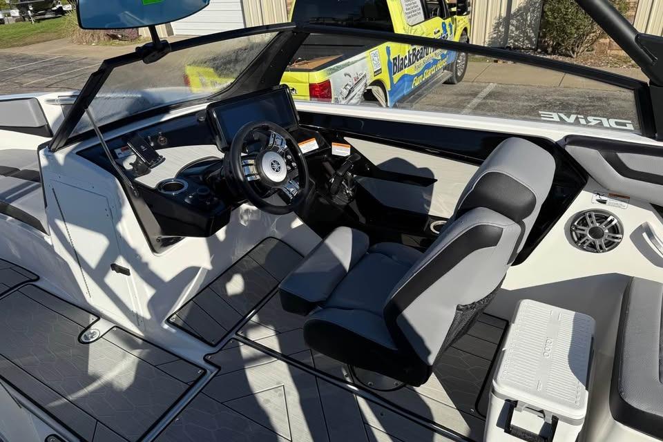 Interior of 2026 Yamaha Boats 222XD, featuring modern dashboard and comfortable seating.