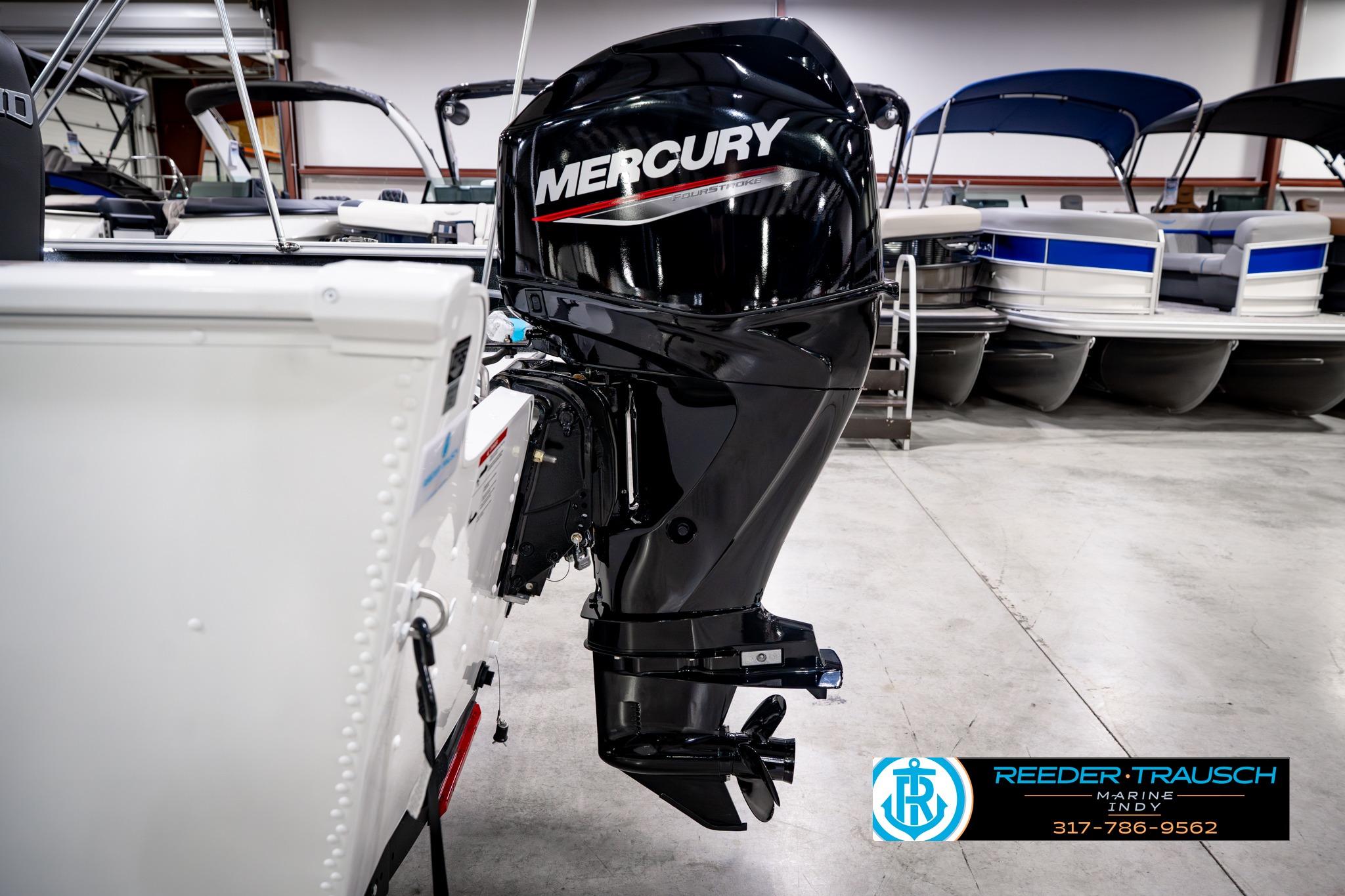 2026 Lund 1650 Rebel XL SS with Mercury outboard motor in showroom.