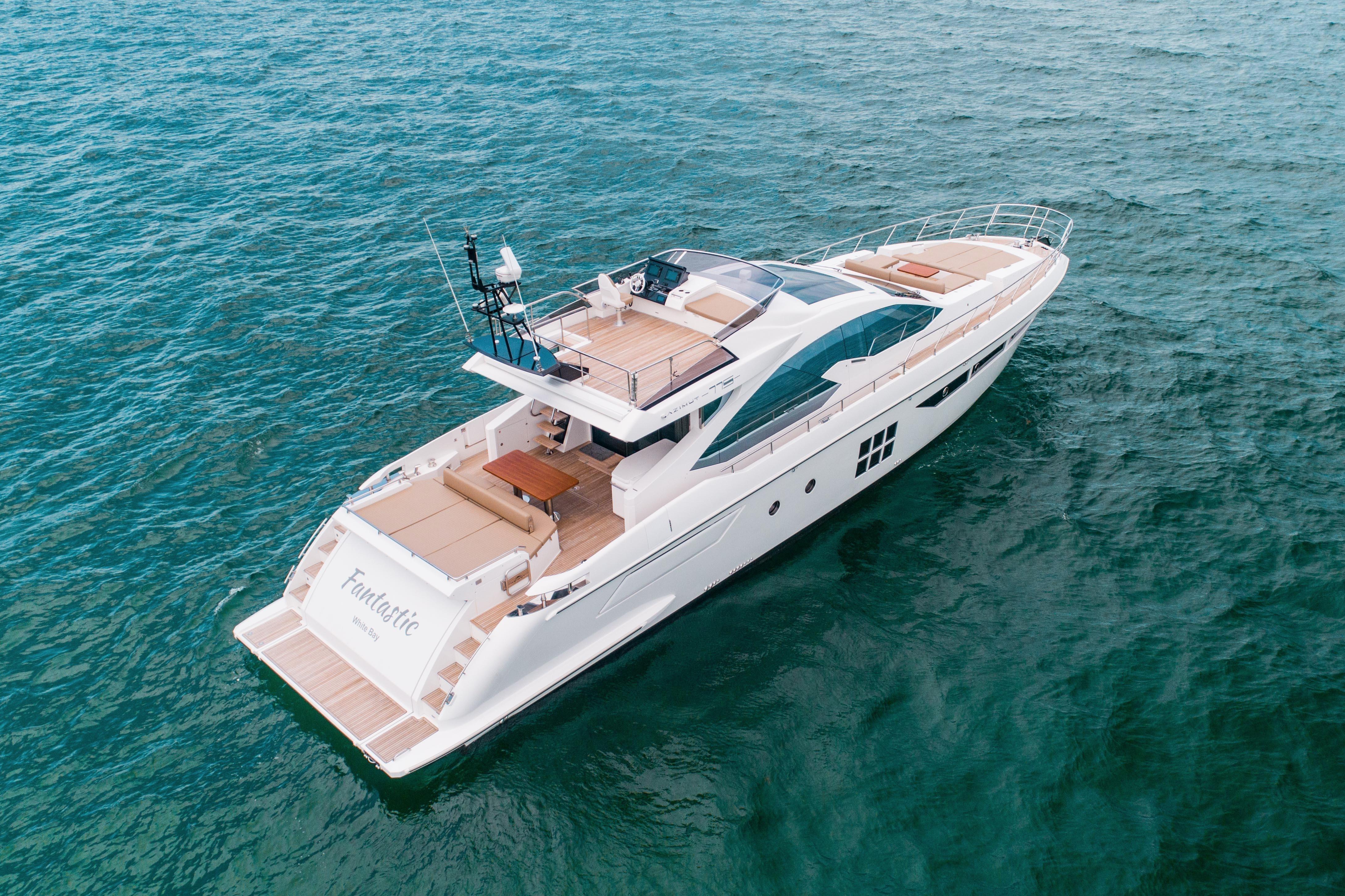 2019 Azimut 77S yacht cruising on open water, showcasing sleek design and luxury features.