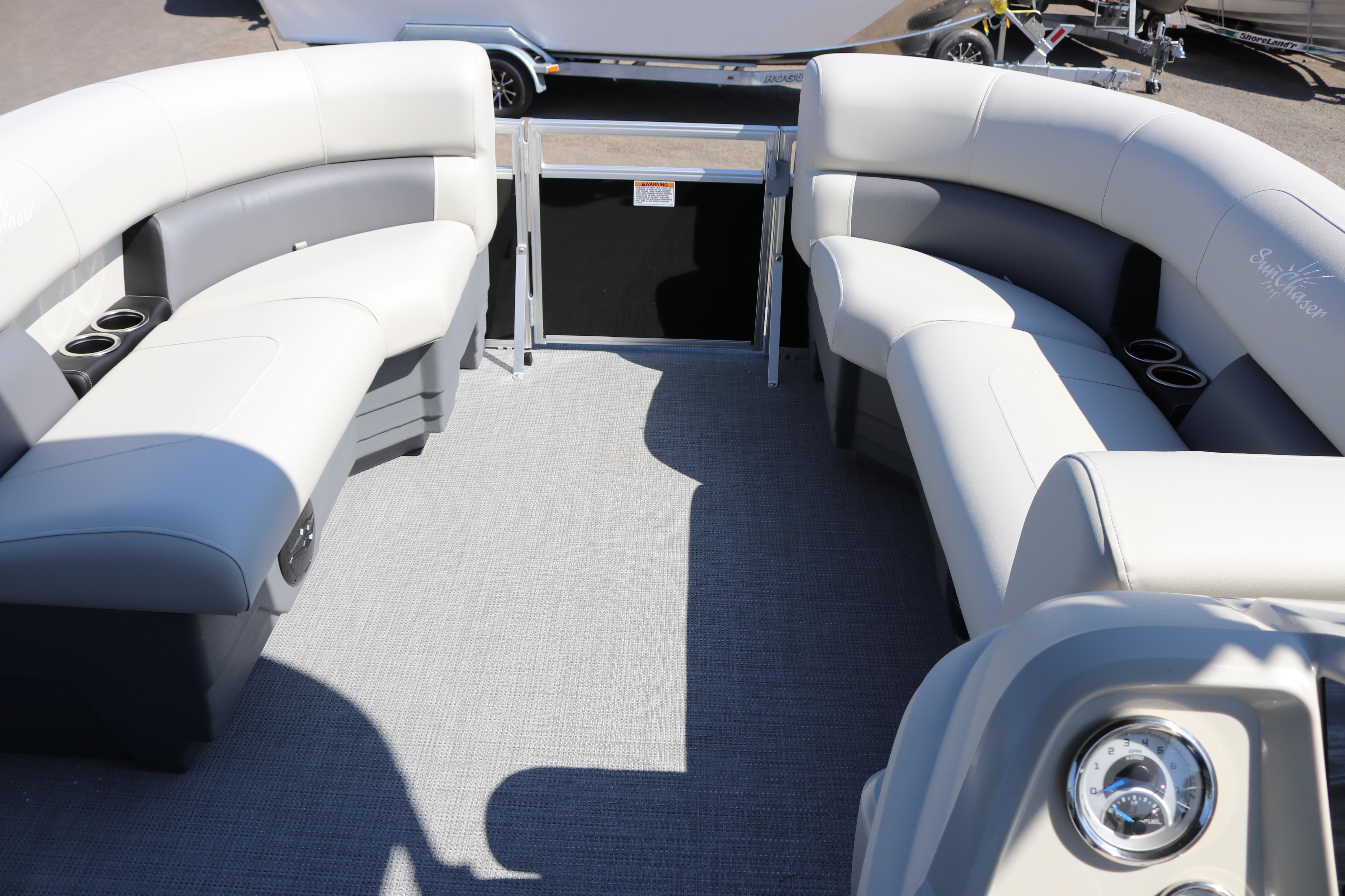 Interior of 2025 SunChaser Vista 20 Fish pontoon boat with plush seating and cup holders.