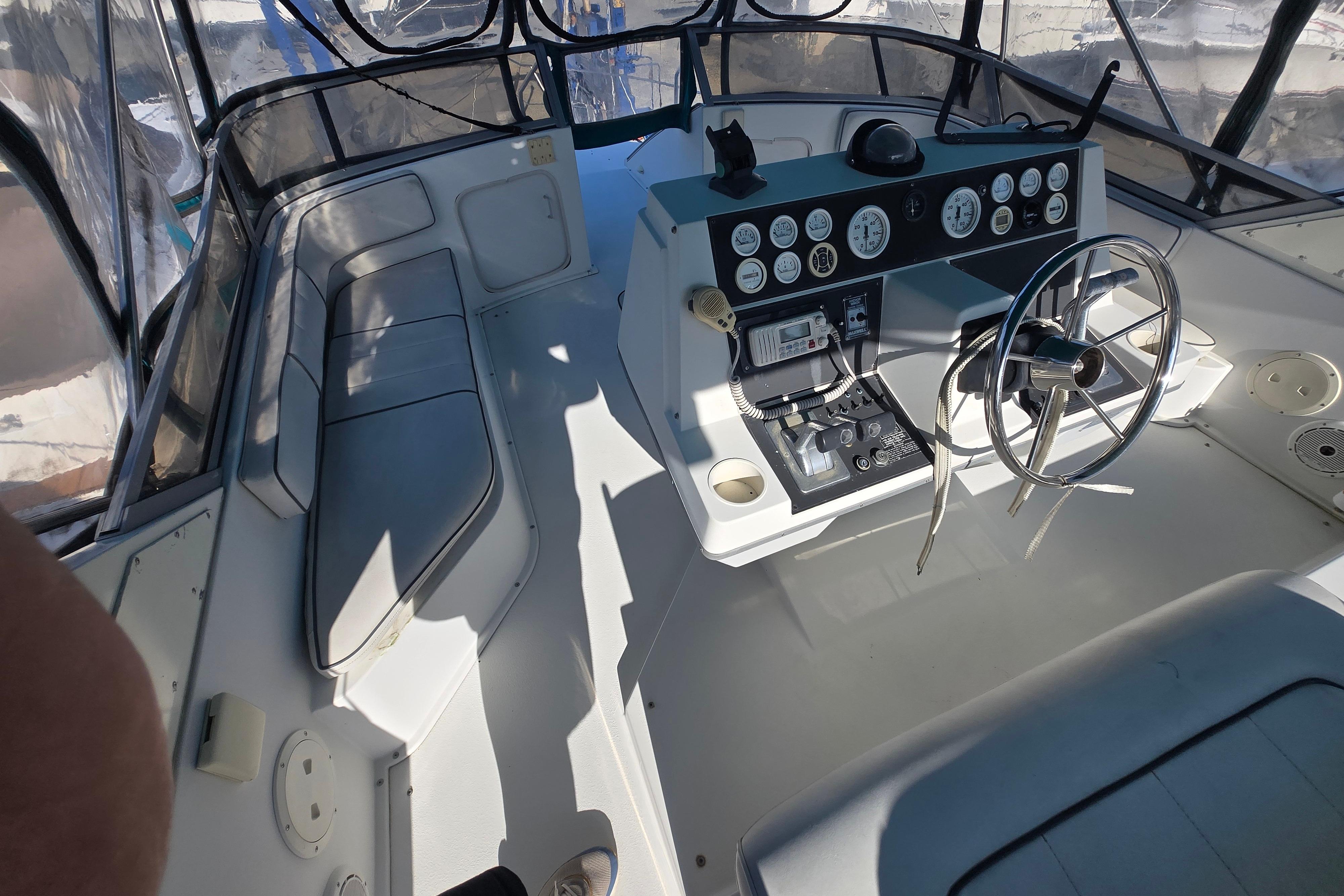 Cockpit of a 1994 Carver 380 Santego yacht with steering wheel and control panel.