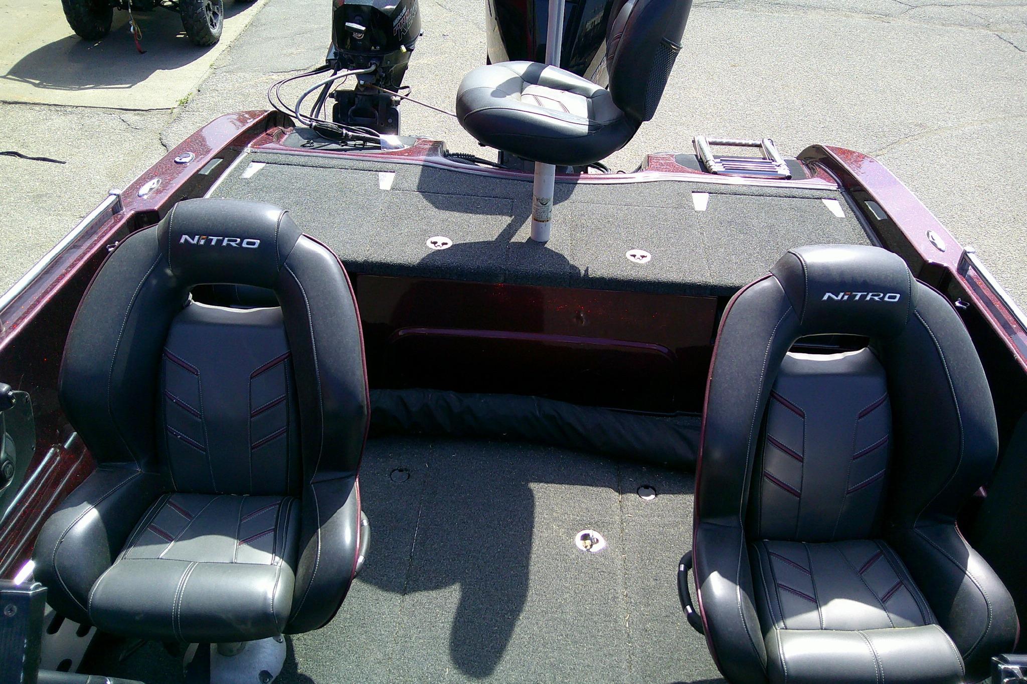 2019 Nitro ZV19 Sport boat interior with three black seats and carpeted deck.
