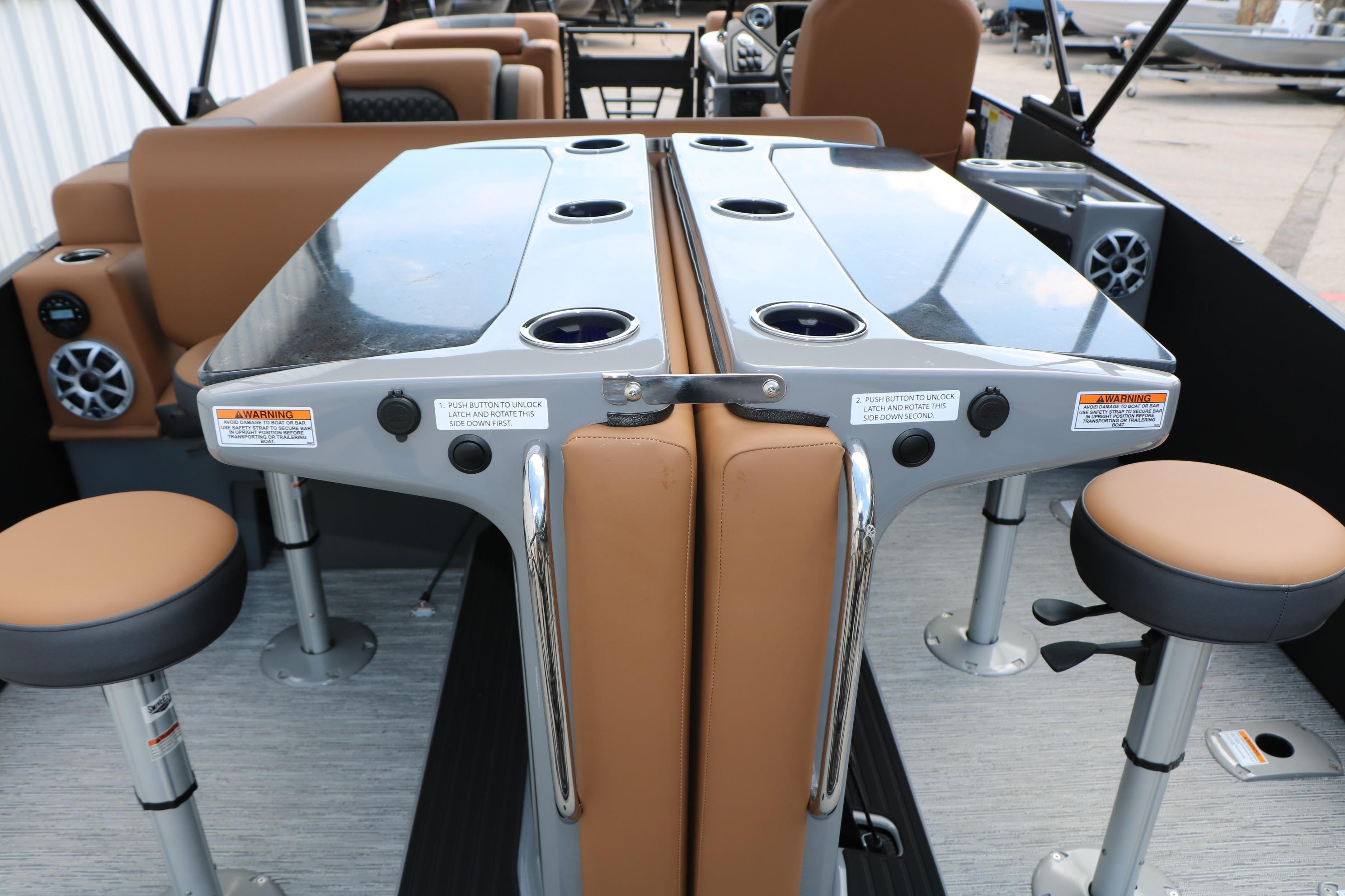 2026 Sylvan L3 DLZ Bar Platinum Edition Tri-Toon interior with bar seating and cup holders.