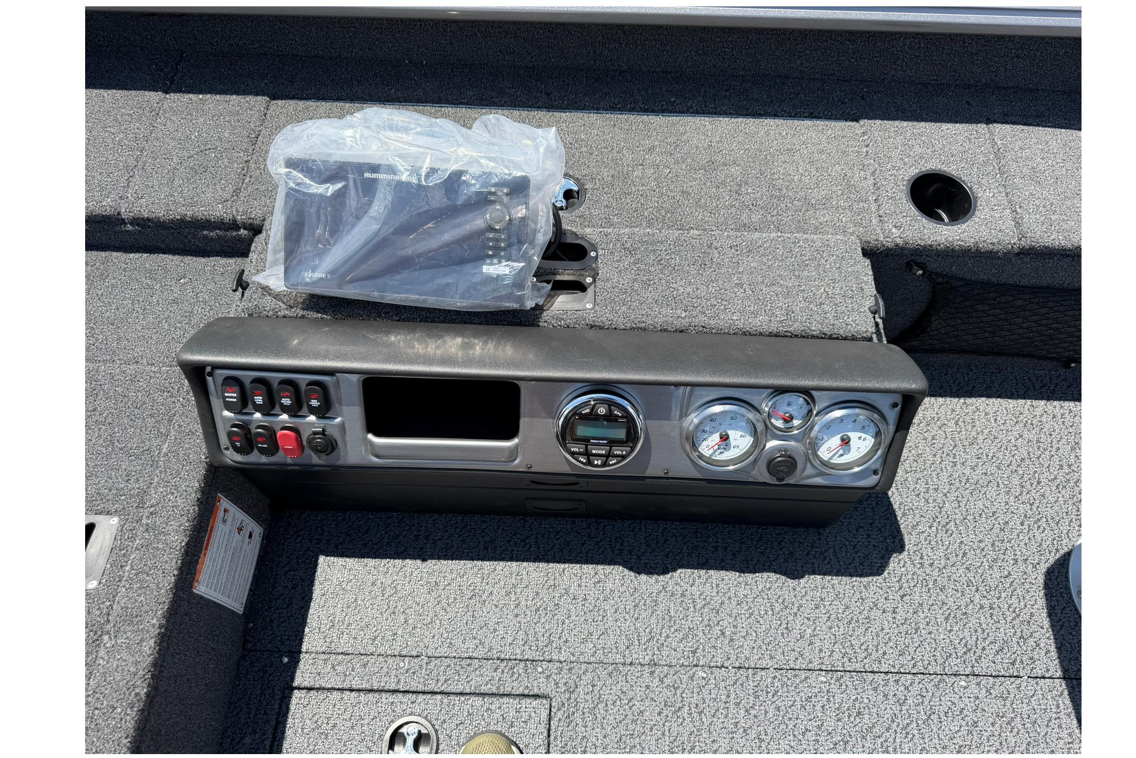 Control panel of 2027 Lund 1875 Pro Guide boat with gauges and switches.