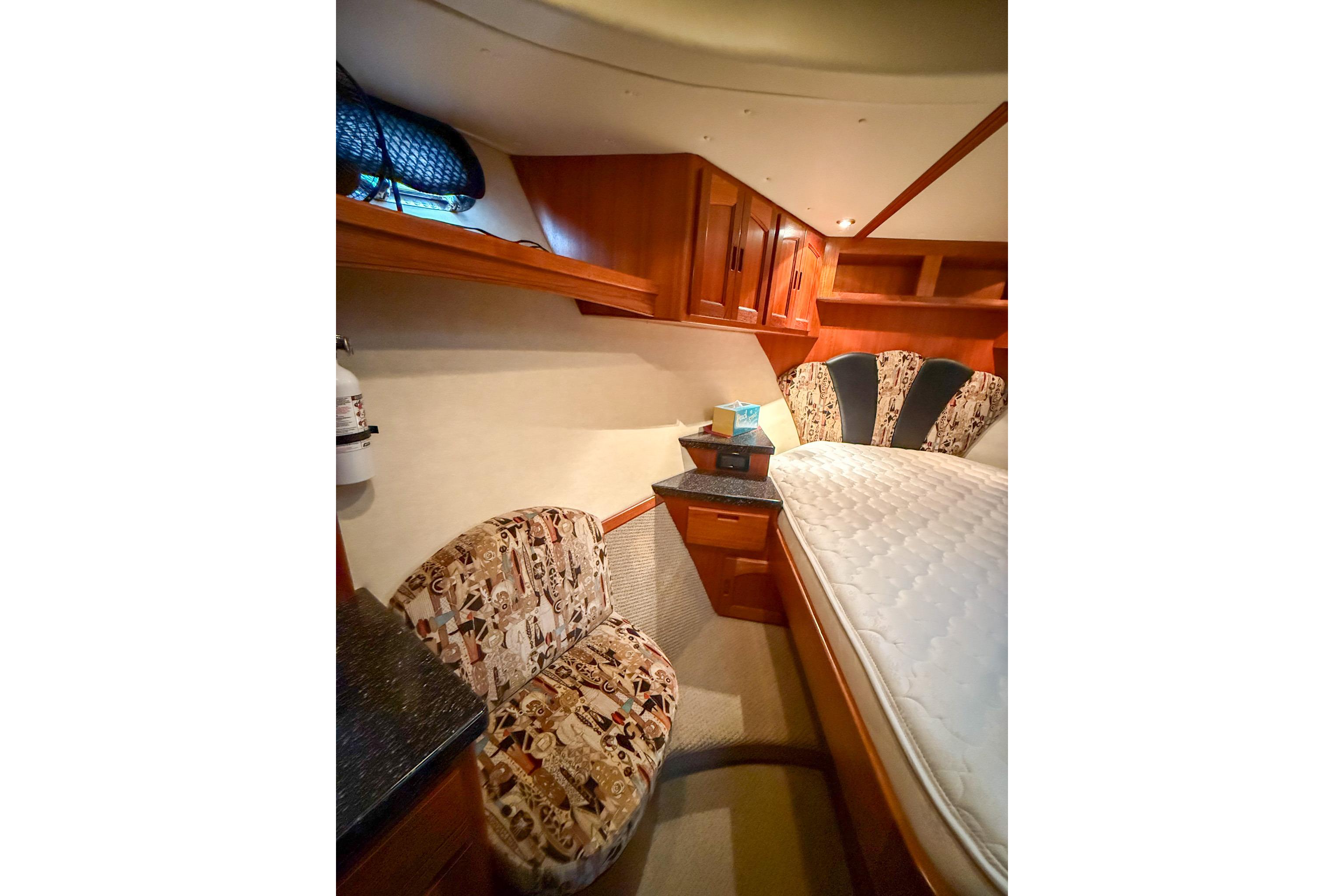Luxurious cabin interior of 2007 Nordic Tug 54 with elegant wood finishes.
