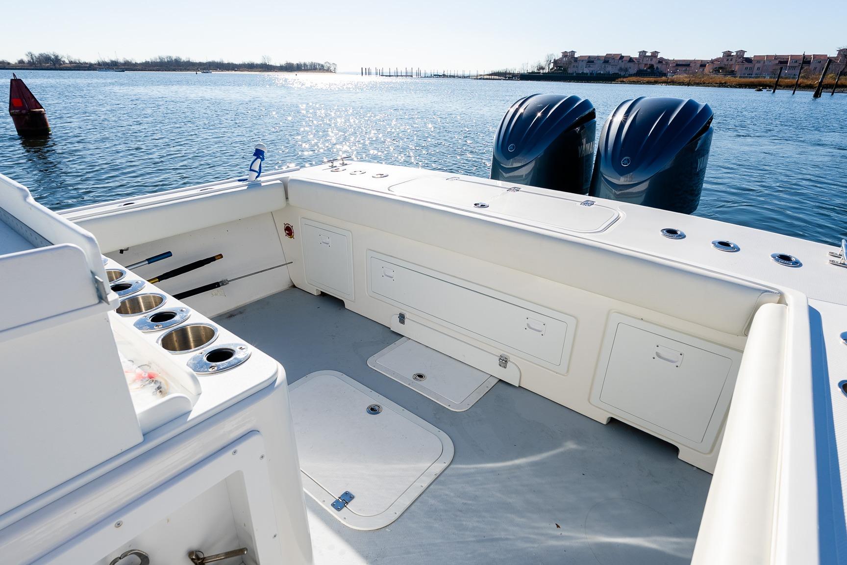 2024 Steiger Craft 31 Fisherman boat interior with dual engines on a sunny day.