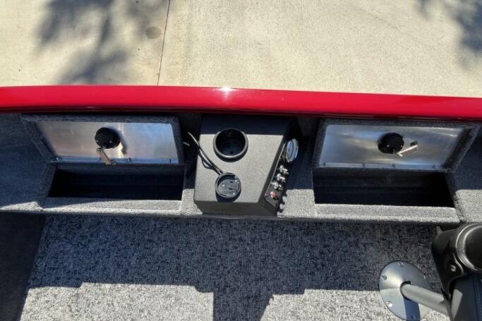 2025 Tracker Super Guide V-16 T boat dashboard with controls and storage compartments.