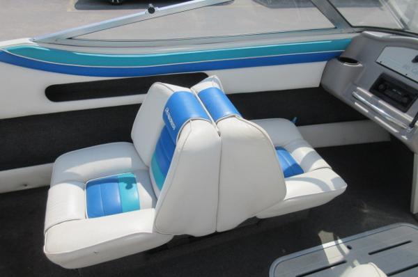 Interior seating of a 1993 Rinker 186 Captiva boat with blue and white upholstery.
