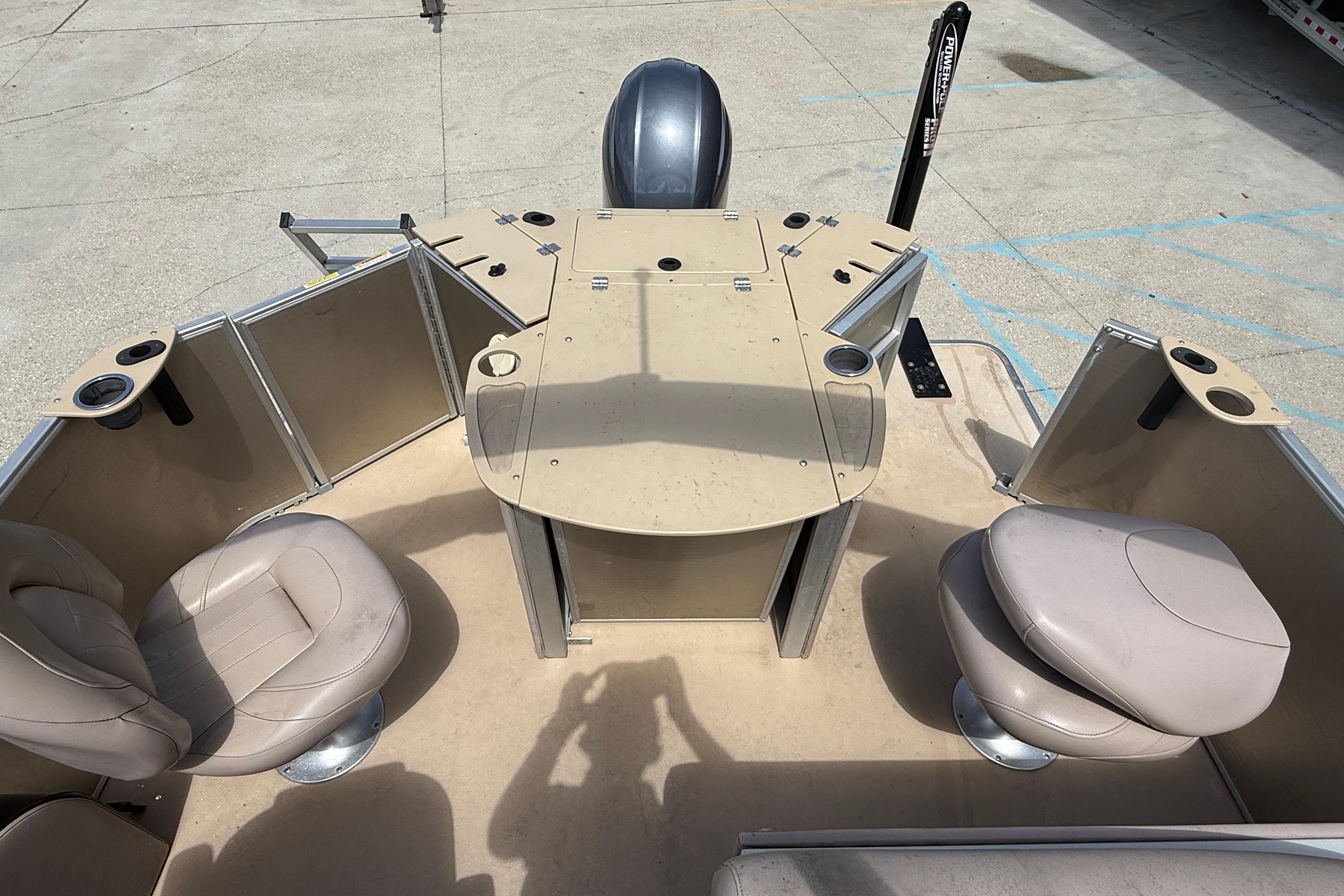 2014 Godfrey Sweetwater 2486 C pontoon boat interior with seating and console.