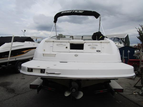 2004 Ebbtide 22 Mystique boat, rear view, on trailer, overcast sky.