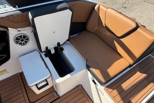 2026 Yamaha Boats 222SE interior with tan seating and storage compartments.