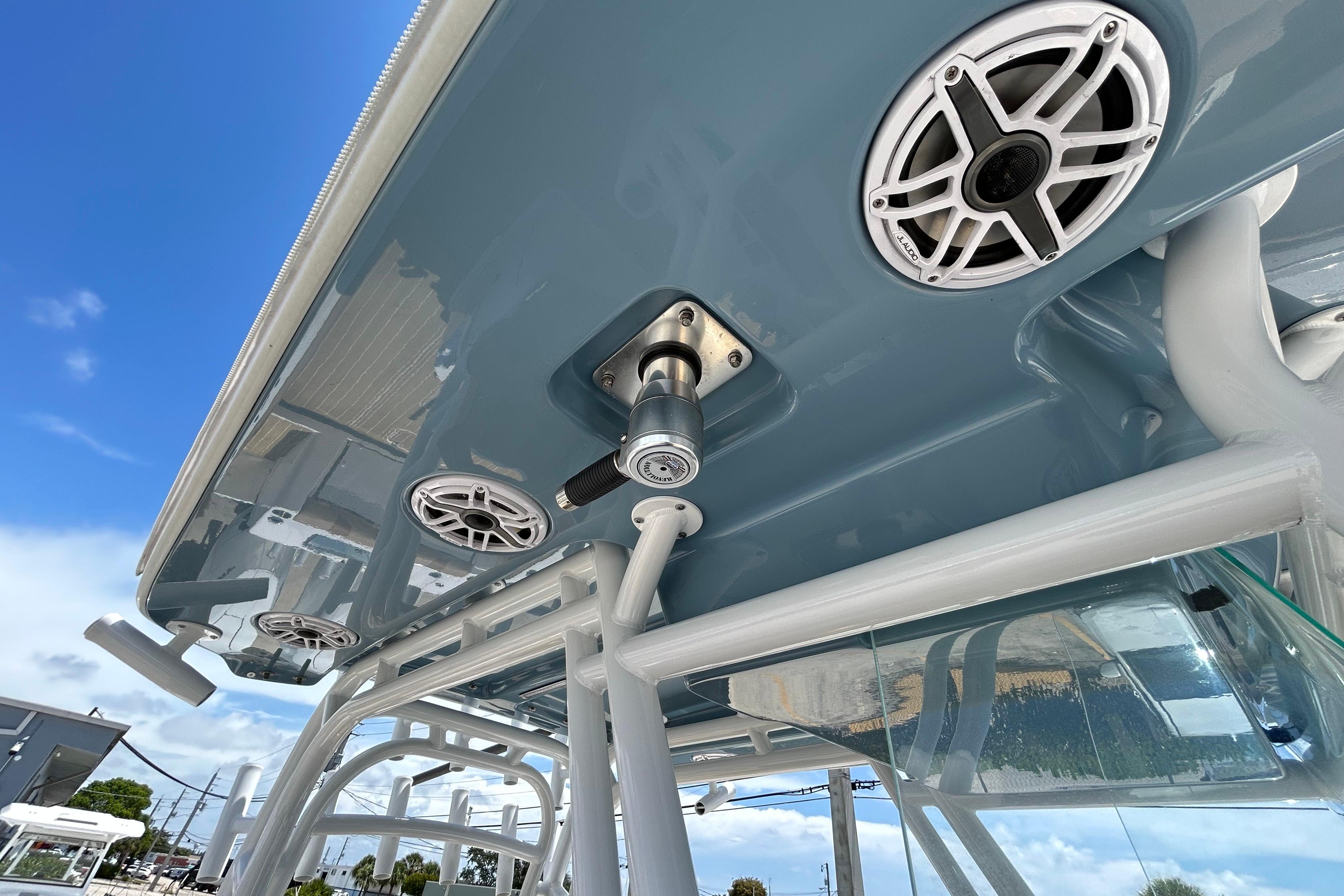 2025 Cape Horn 34 XS boat roof with speakers and rod holders under clear blue sky.