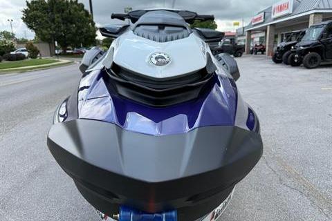 2025 Sea-Doo GTI SE 130 jet ski, front view, parked outdoors near dealership.