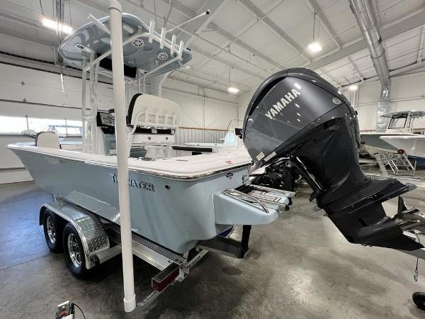 2025 Tidewater 2300 Carolina Bay boat with Yamaha engine in showroom.