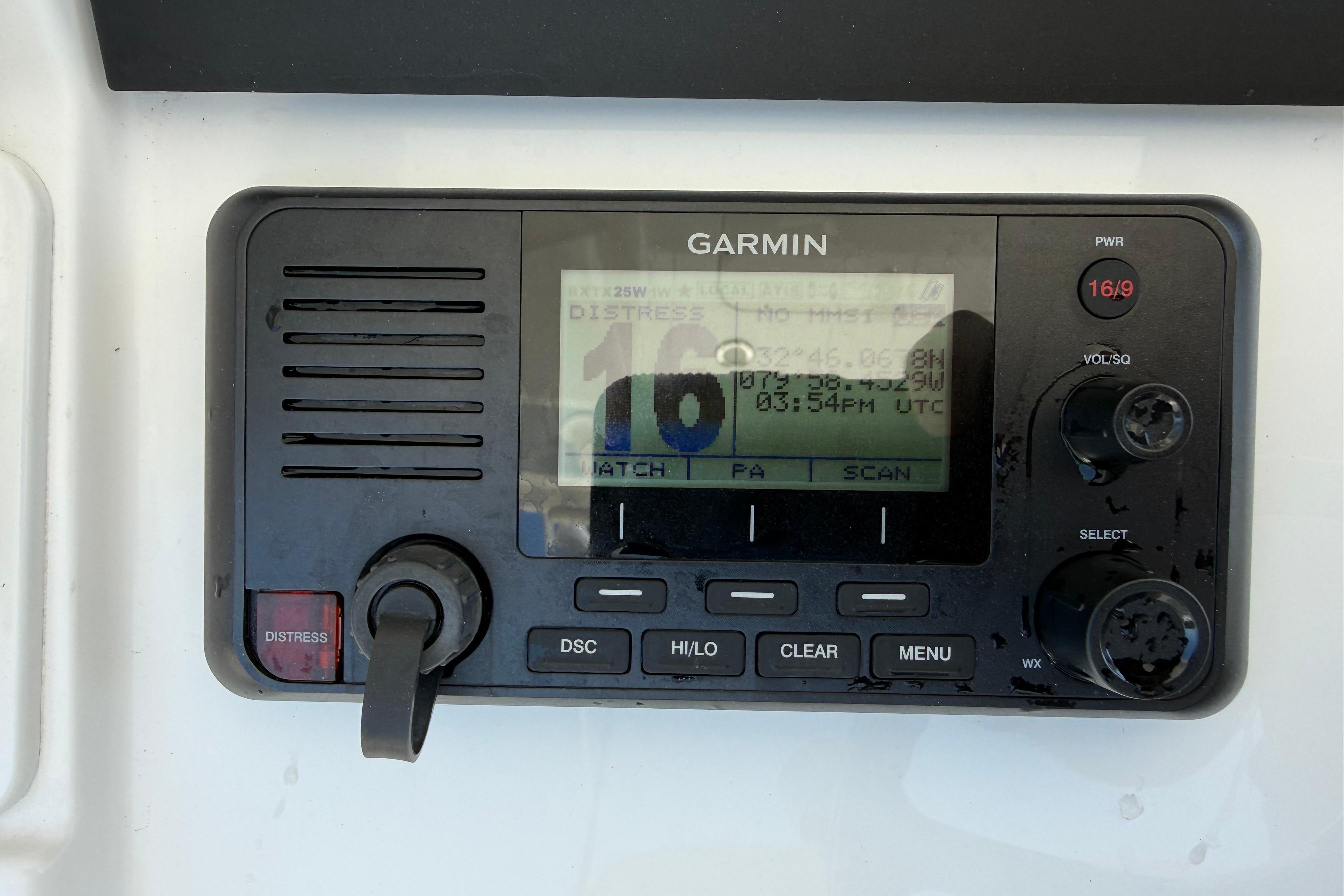 Garmin marine radio on 2023 Regulator 26XO boat, displaying distress signal.