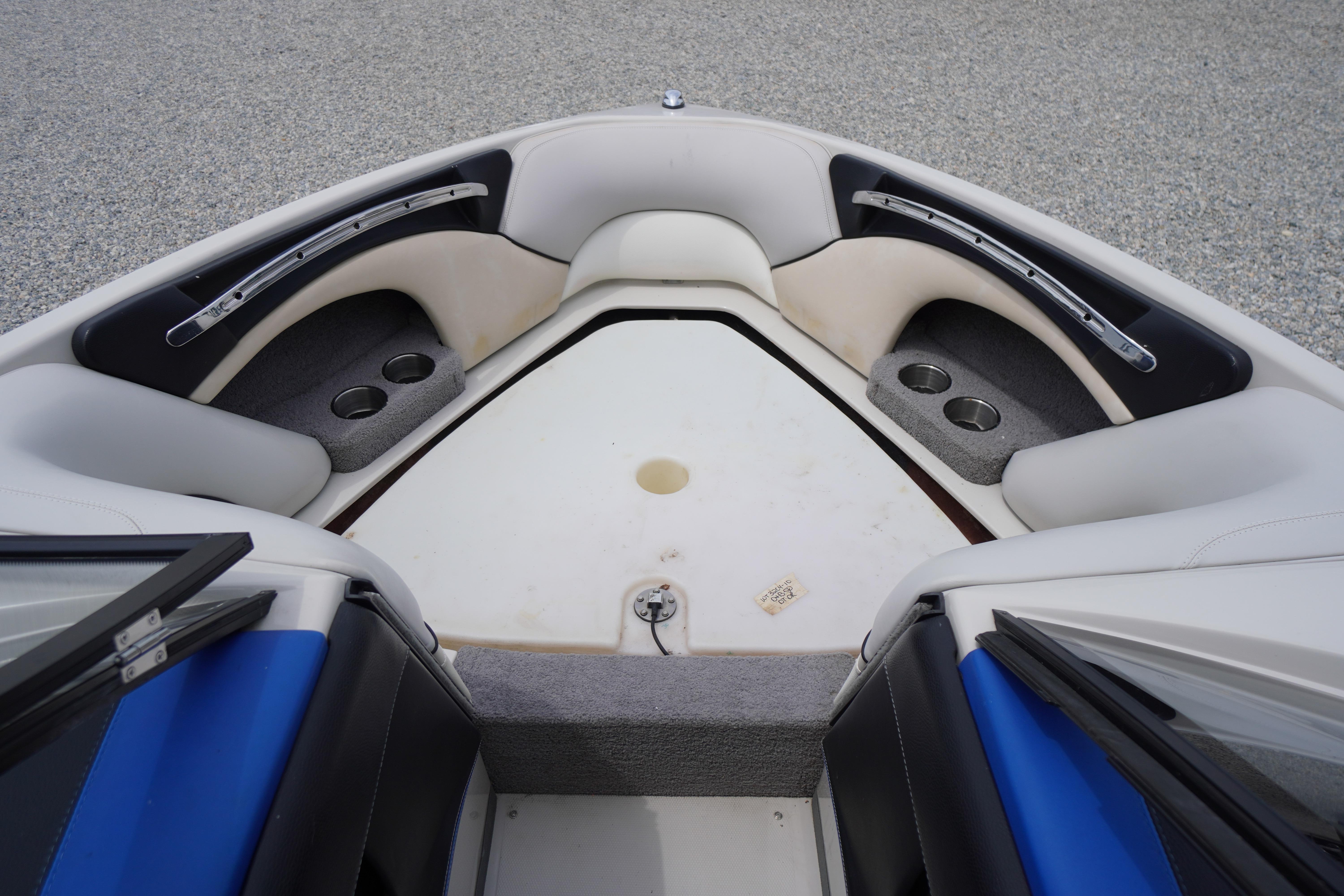 2011 Malibu Wakesetter 21 VLX boat interior with cup holders and seating.