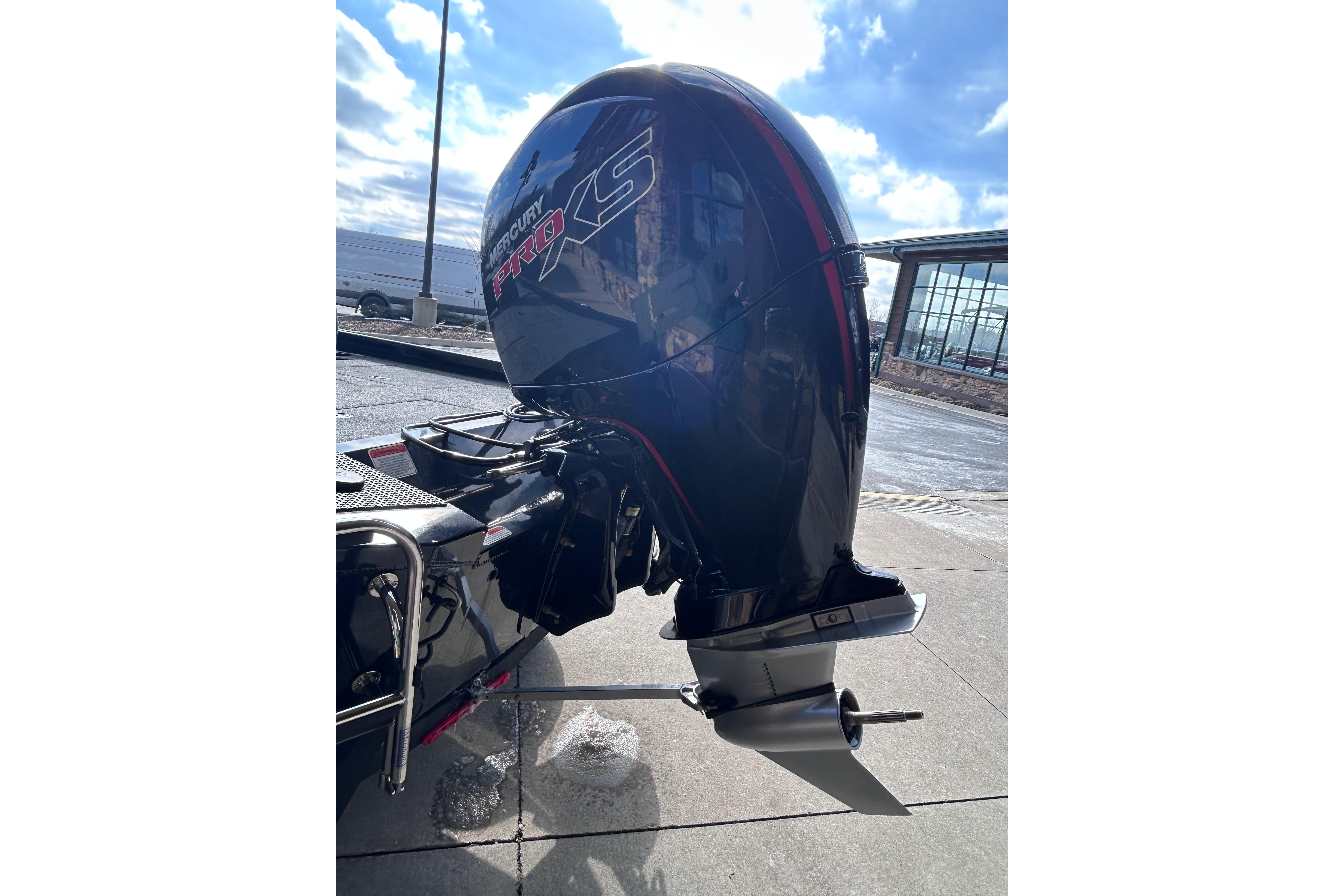 2025 Ranger RT198P boat with Mercury Pro XS outboard motor, parked on a sunny day.