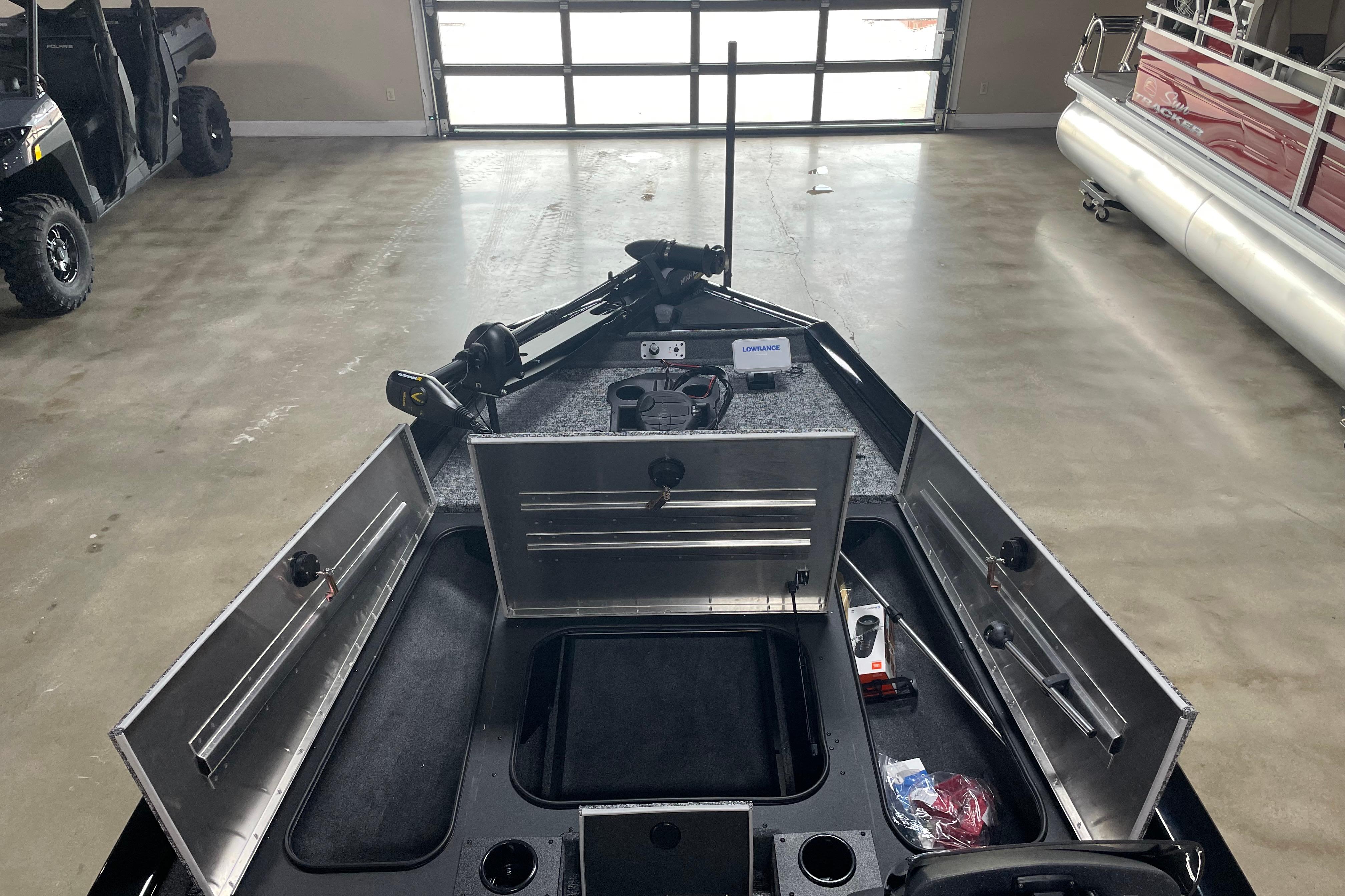 2026 Tracker Pro Team 175 Crappie Edition boat interior with open storage compartments.