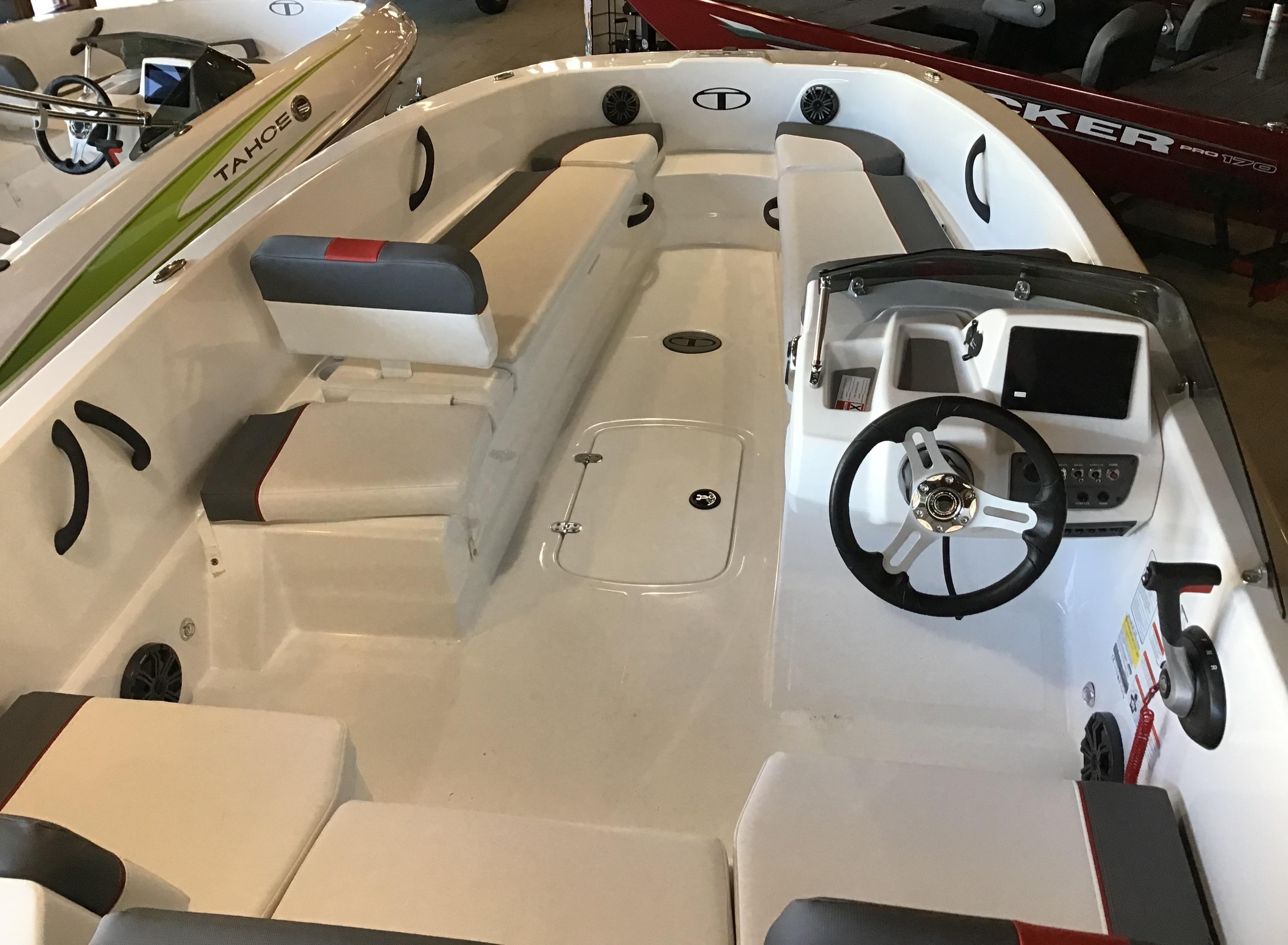 2025 Tahoe T18 boat interior with seating and steering console.