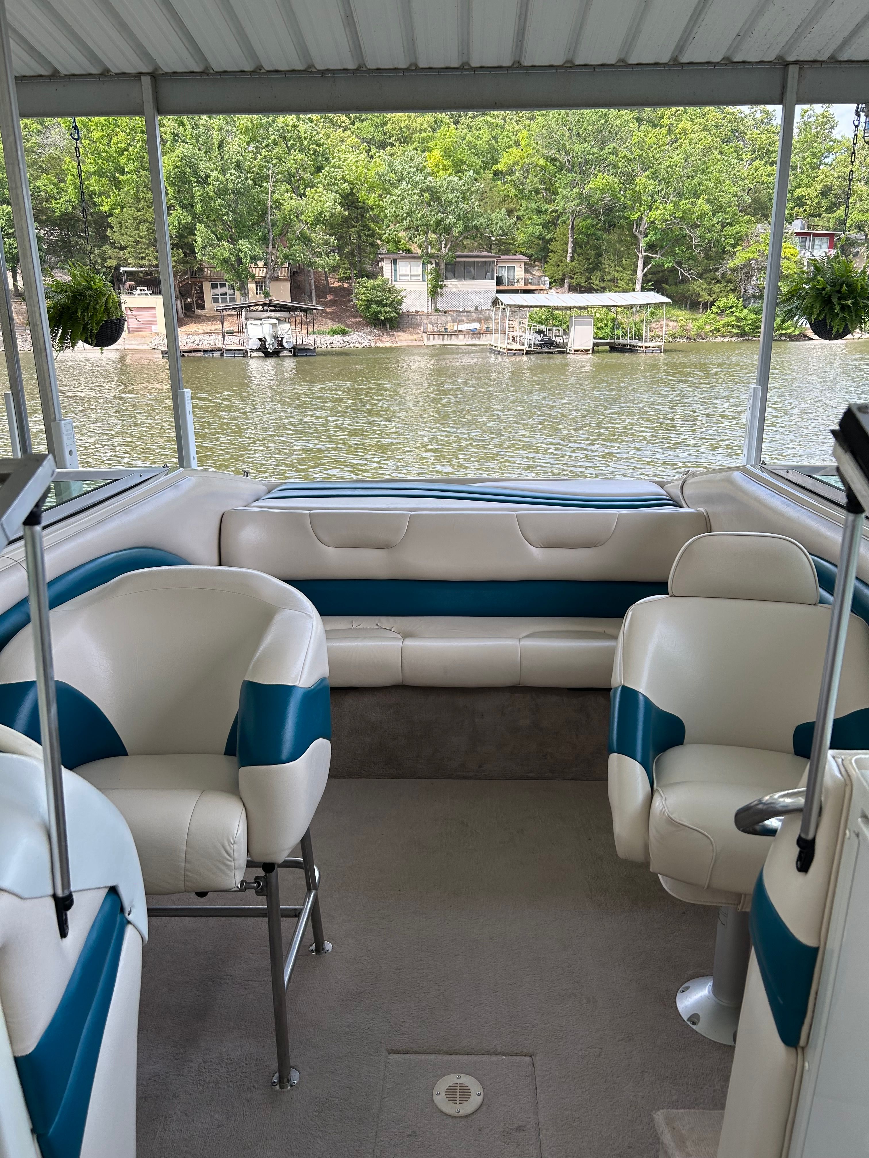 Interior of a 1995 Crownline 266 BR boat with seating area.