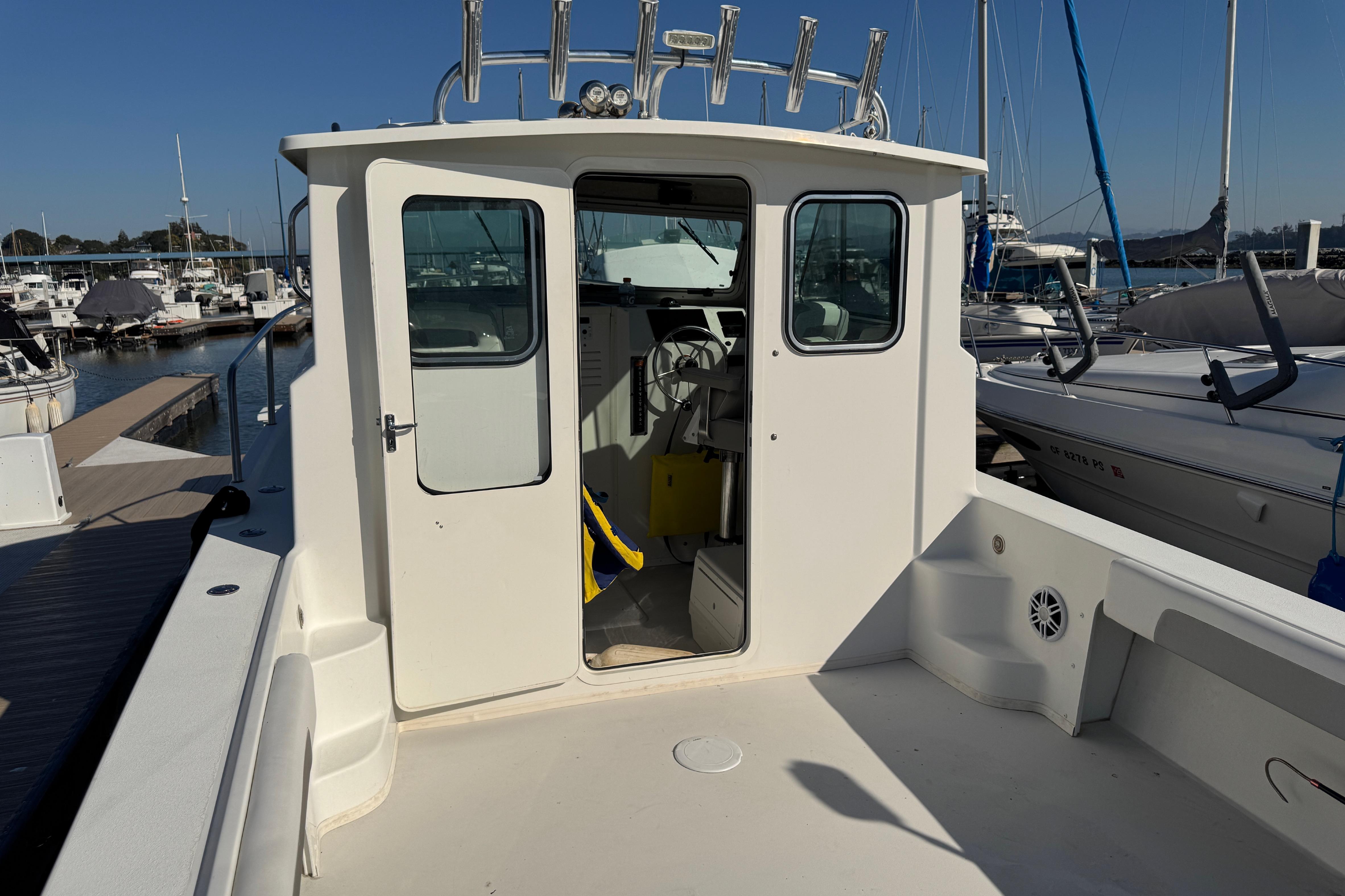 2021 Parker 2820 XLD Sport Cabin boat docked at marina, showcasing cabin entrance.