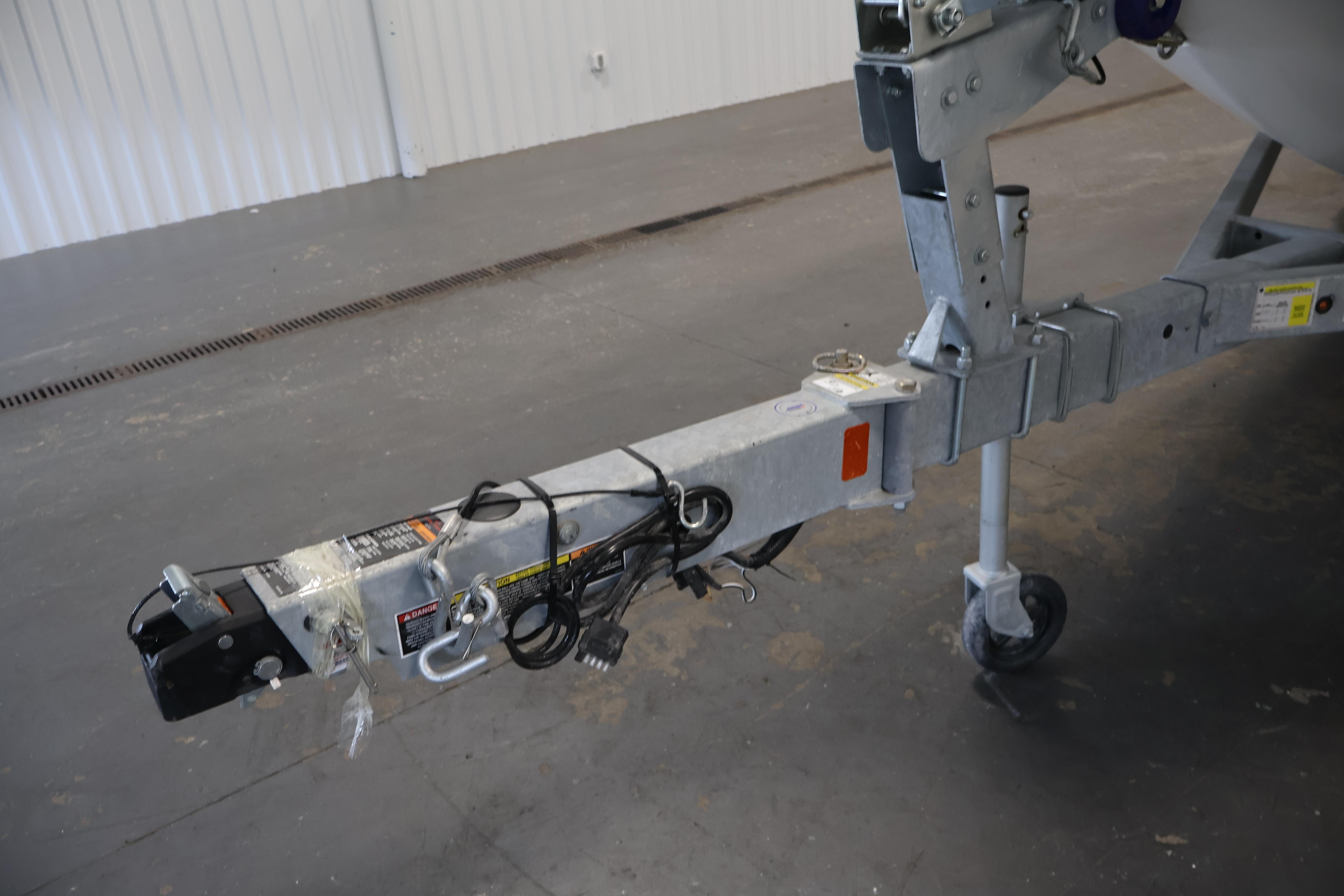 Trailer hitch of 2026 Bayliner Trophy T18 boat in a garage setting.