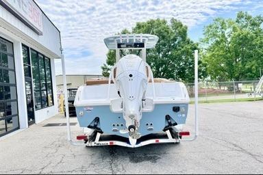2026 Sea Hunt Ultra 255 SE boat on trailer, rear view, outdoors.