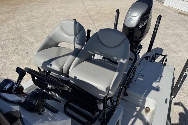 2025 Majek 24 Reaper boat with dual seats and Suzuki outboard motor.