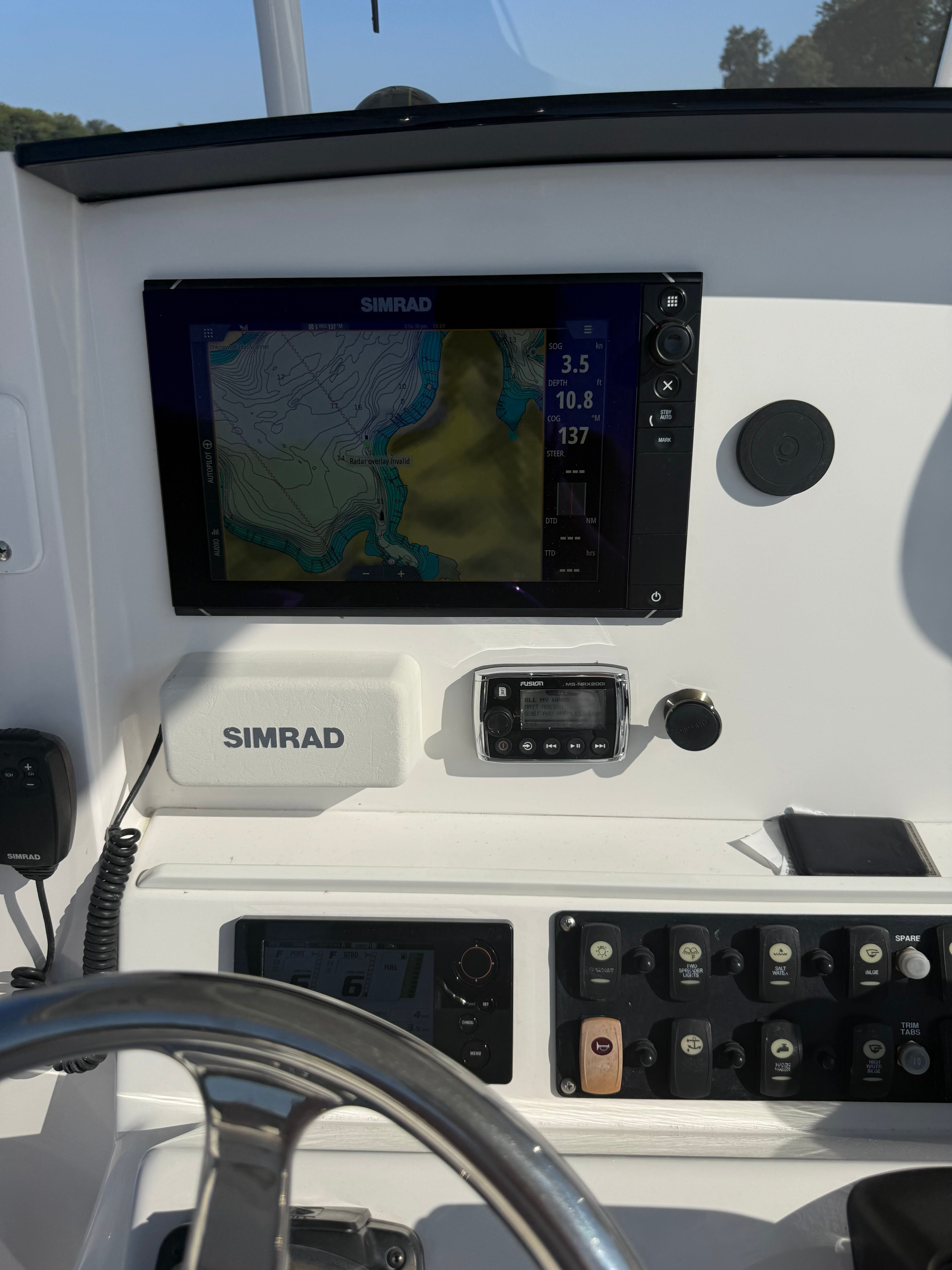 2017 Southport 272 FE boat dashboard with Simrad navigation system and control panel.
