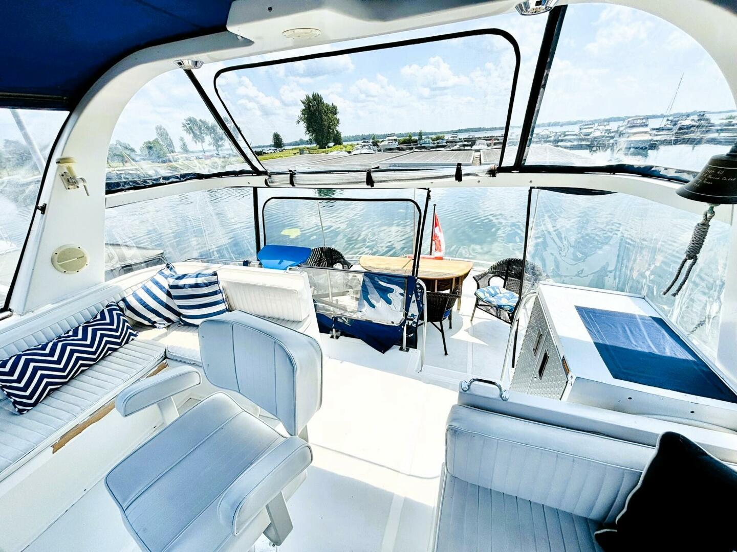 Interior of 1985 DeFever 40 Offshore yacht with seating and water view.