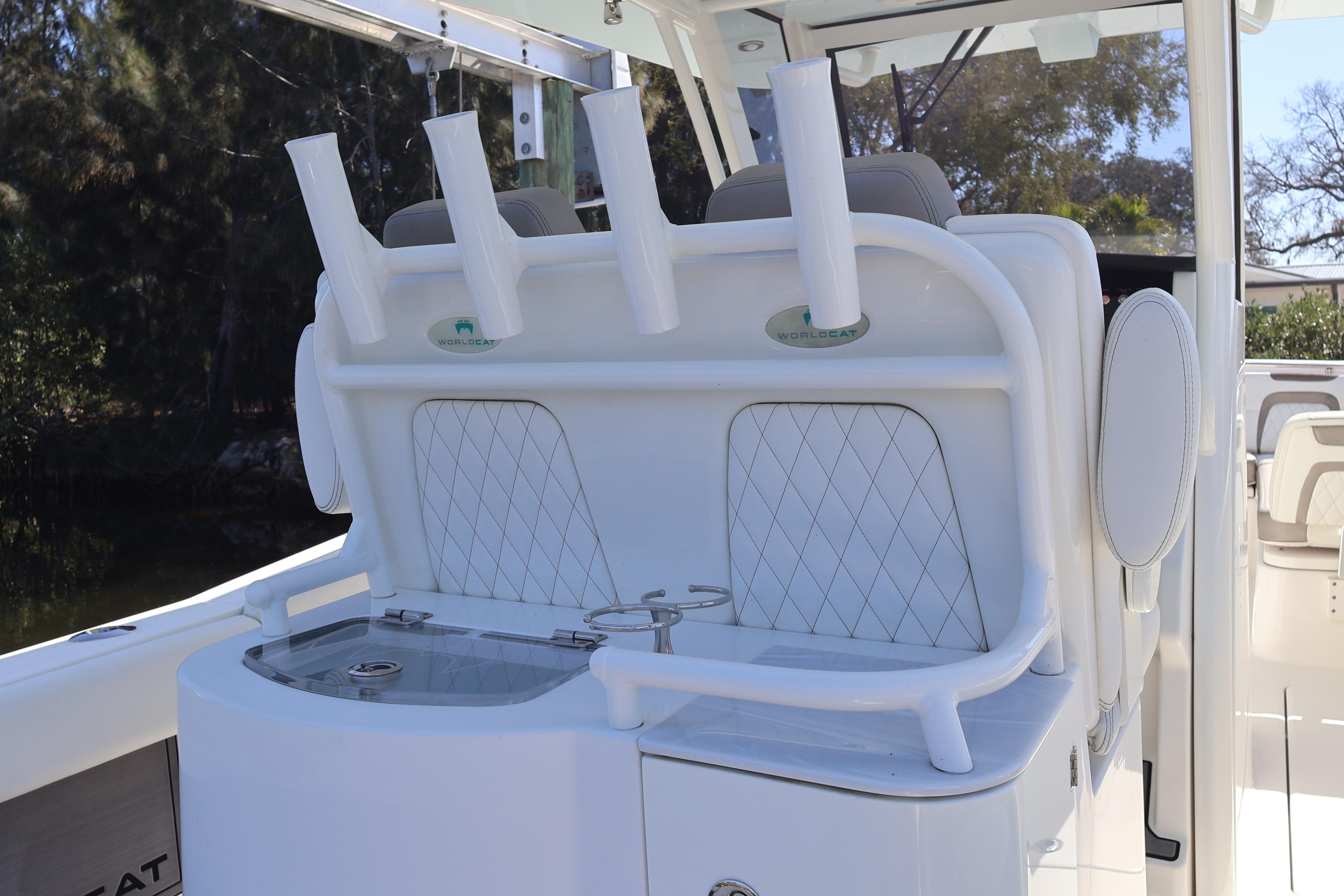 2022 World Cat 280 CC-X boat interior with rod holders and seating.