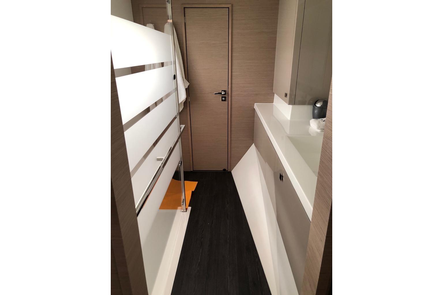 Modern bathroom interior of 2020 Fountaine Pajot Saona 47 yacht, featuring sleek design elements.