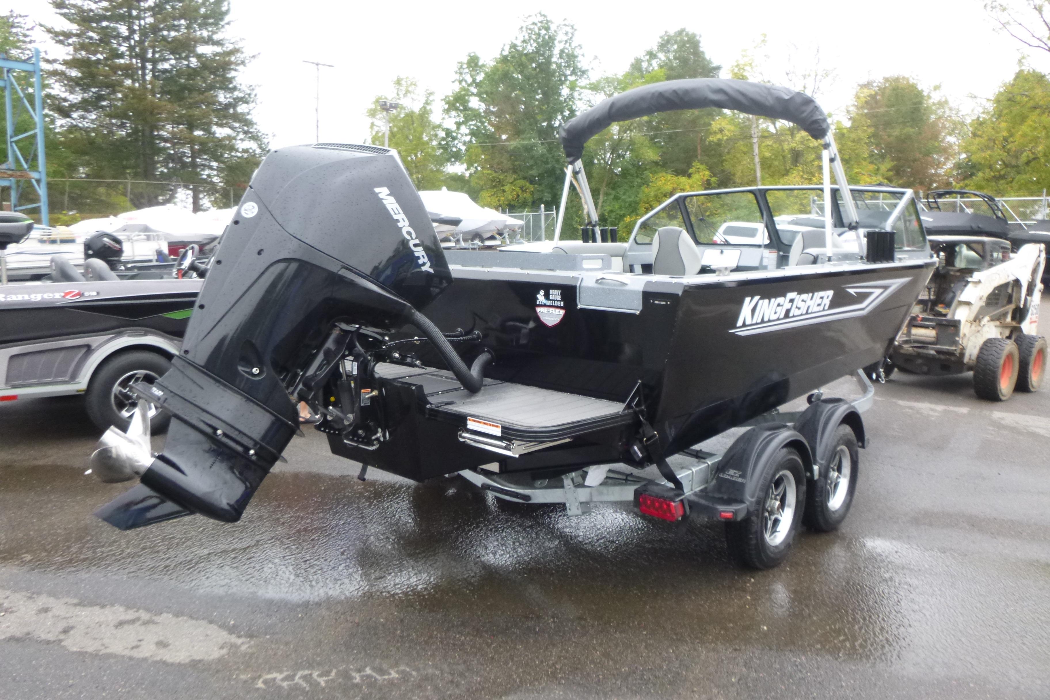 KingFisher 2025 Escape boat, 2026 model, on trailer with Mercury outboard motor.