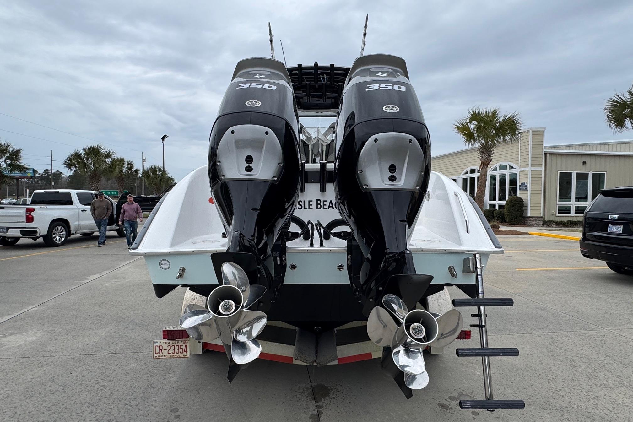 2024 Cape Horn 32 XS boat with dual 350 horsepower engines, parked outdoors.