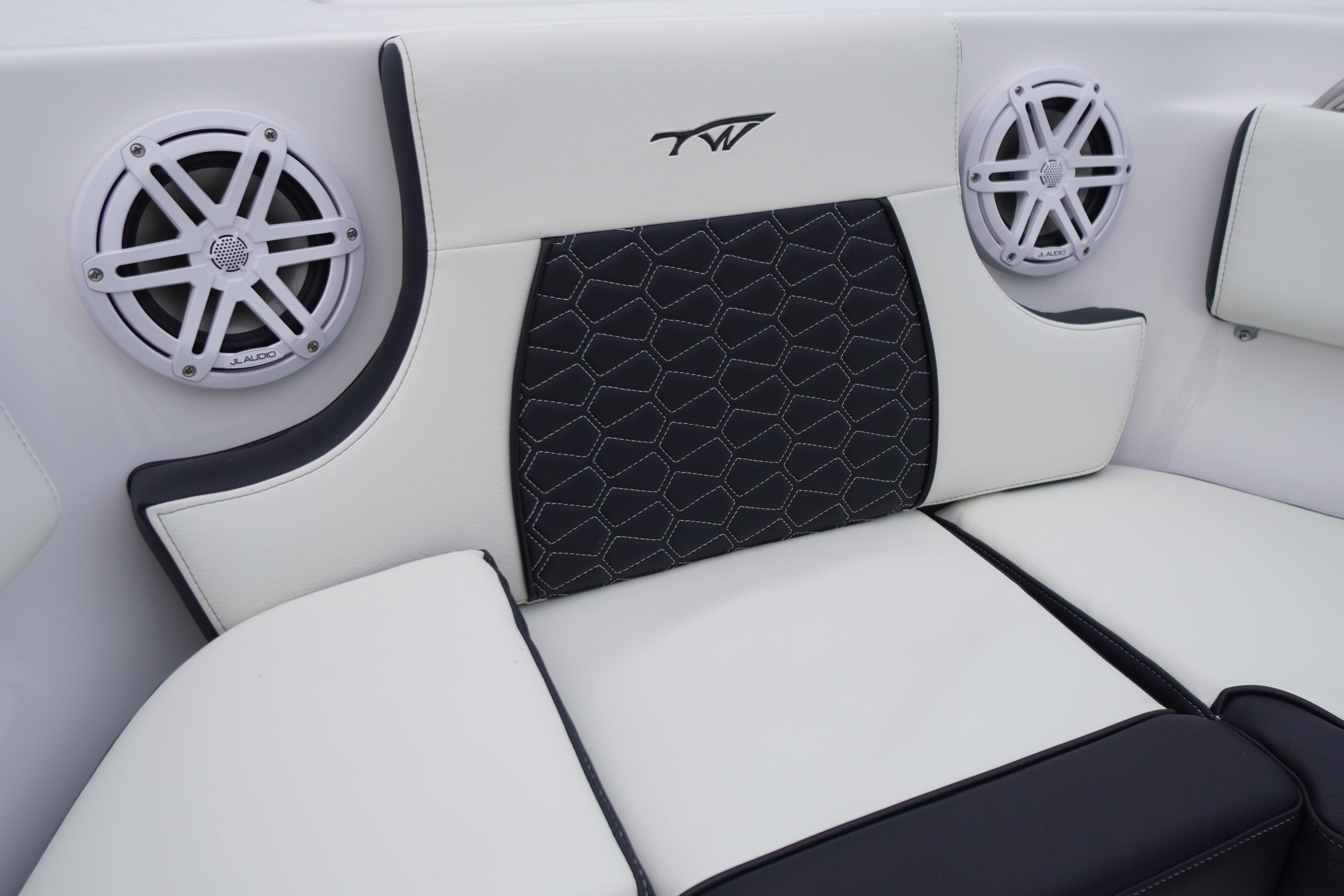 2026 Tidewater 232 SS boat interior with stylish seating and JL Audio speakers.