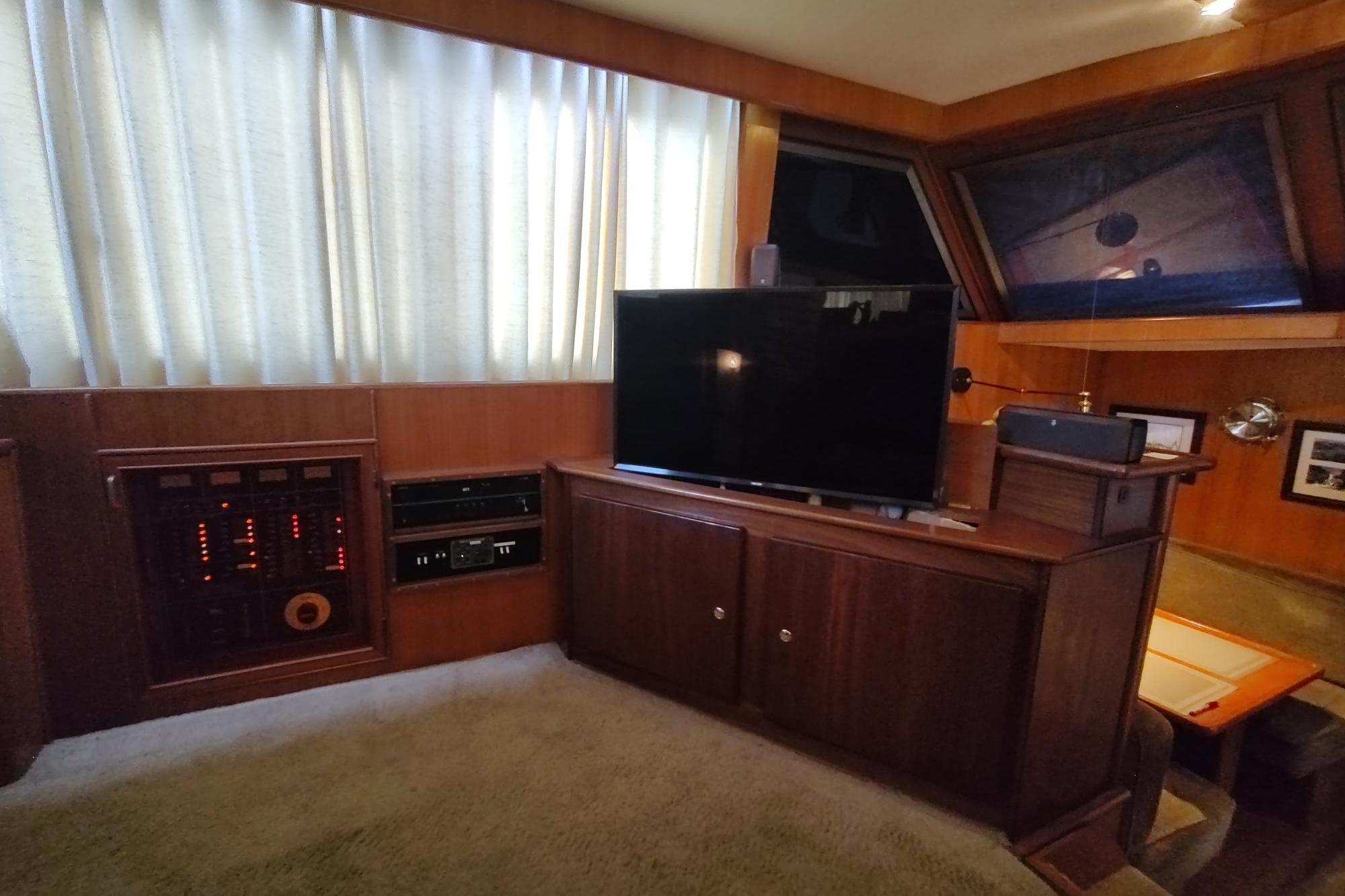 Luxurious interior of 1989 Hyatt Double Cabin Motoryacht with wood paneling and modern amenities.