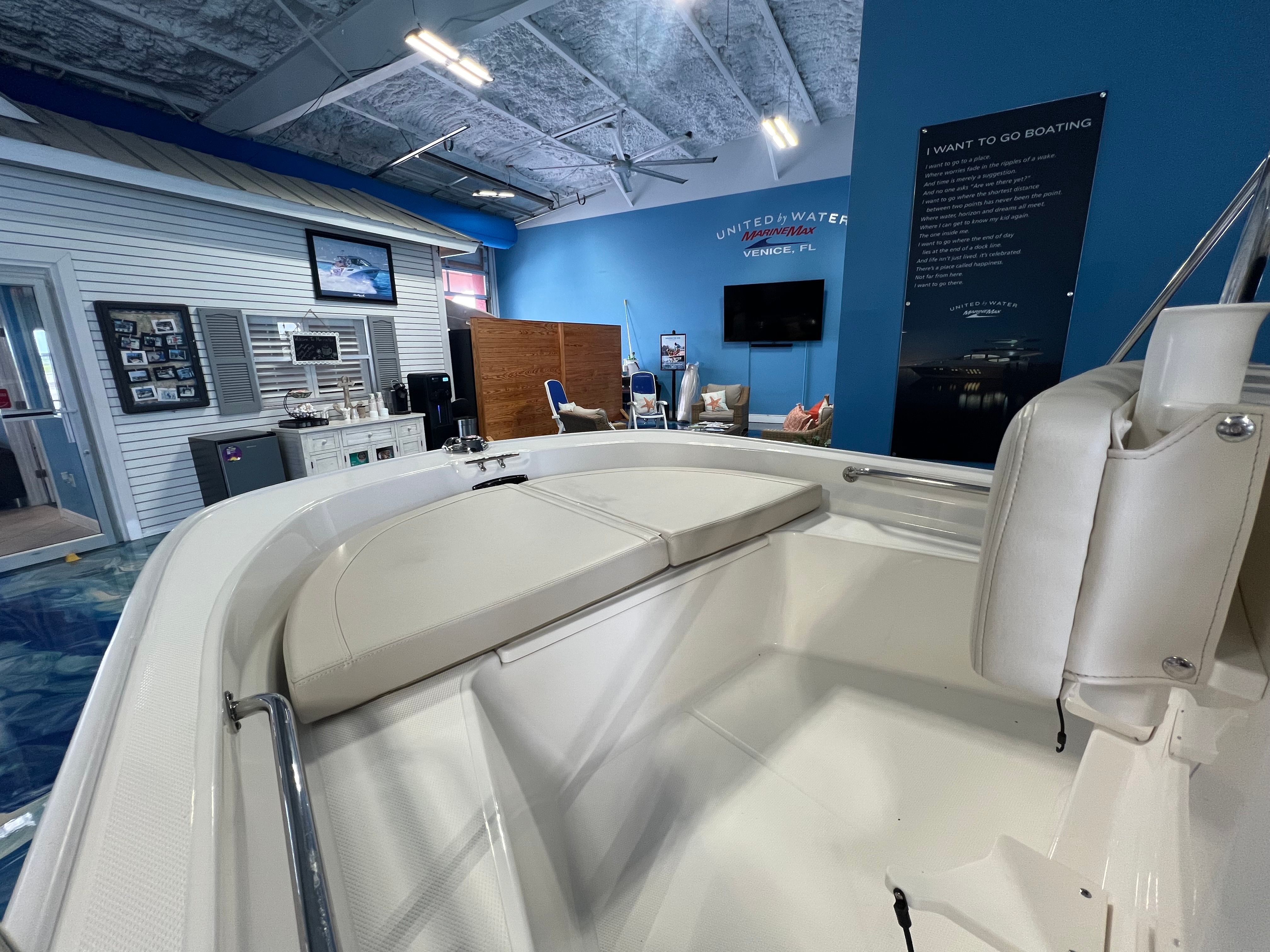2026 Boston Whaler 150 Montauk in showroom, interior view.