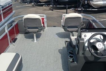 2026 Sun Tracker Bass Buggy 18 DLX pontoon boat interior with seating and steering console.