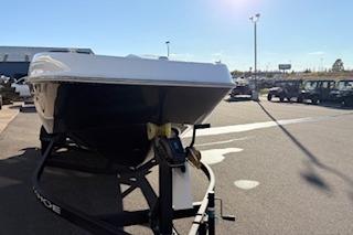 2026 Tahoe T21 boat on trailer in sunny outdoor dealership lot.