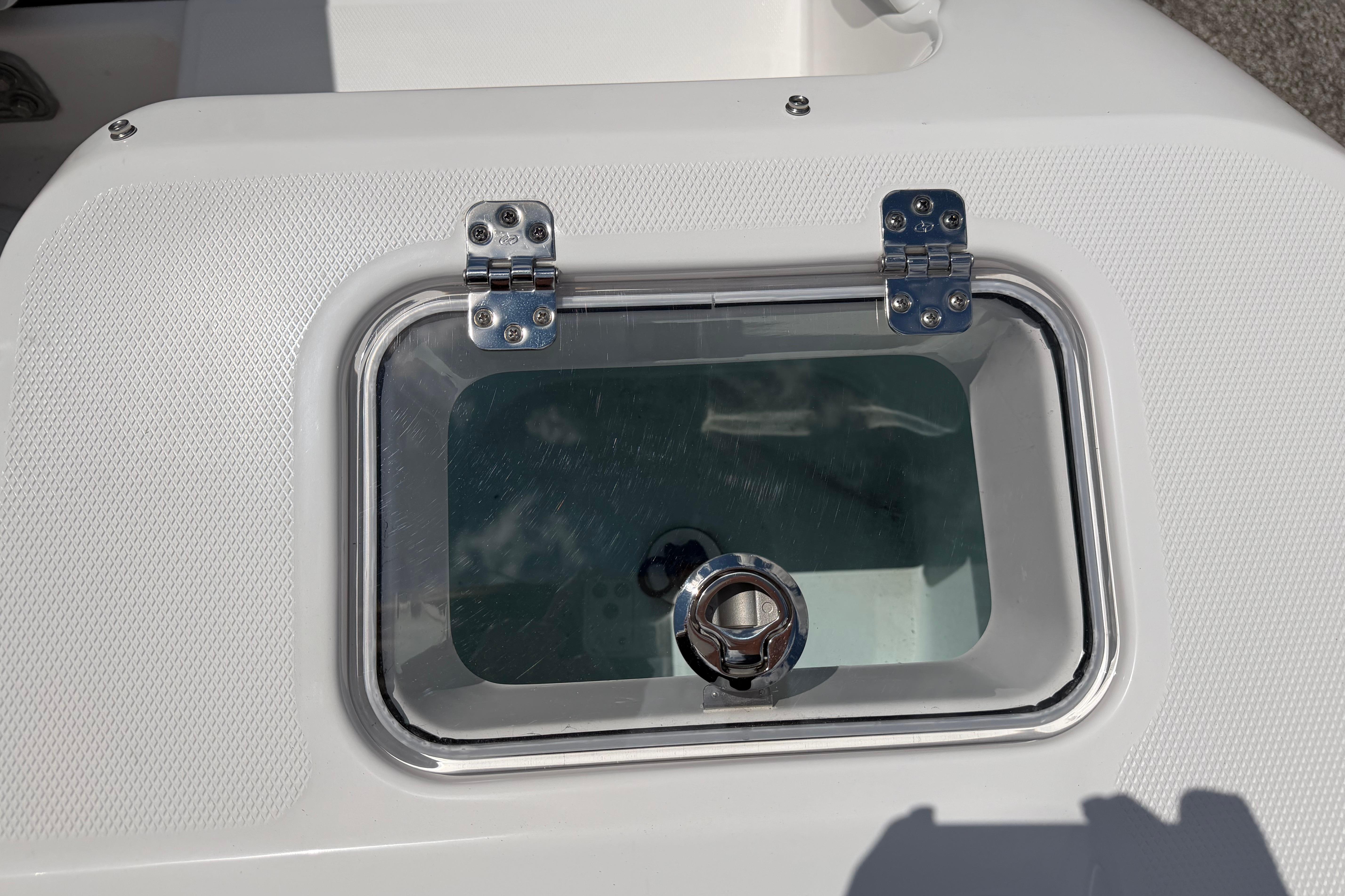 Livewell hatch on 2026 Edgewater 248CX Crossover boat, featuring stainless steel hinges.