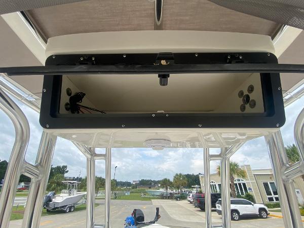 2024 Key West 203 FS boat with open storage compartment.