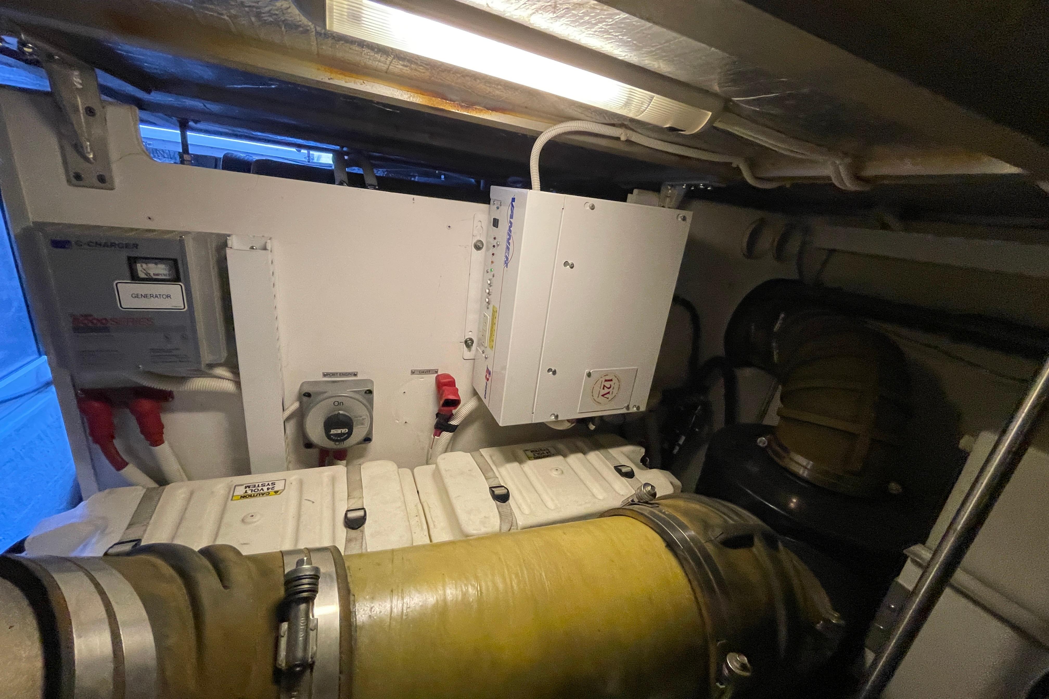 Engine room of 2002 Carver 570 Voyager Pilothouse with generator and mechanical components.