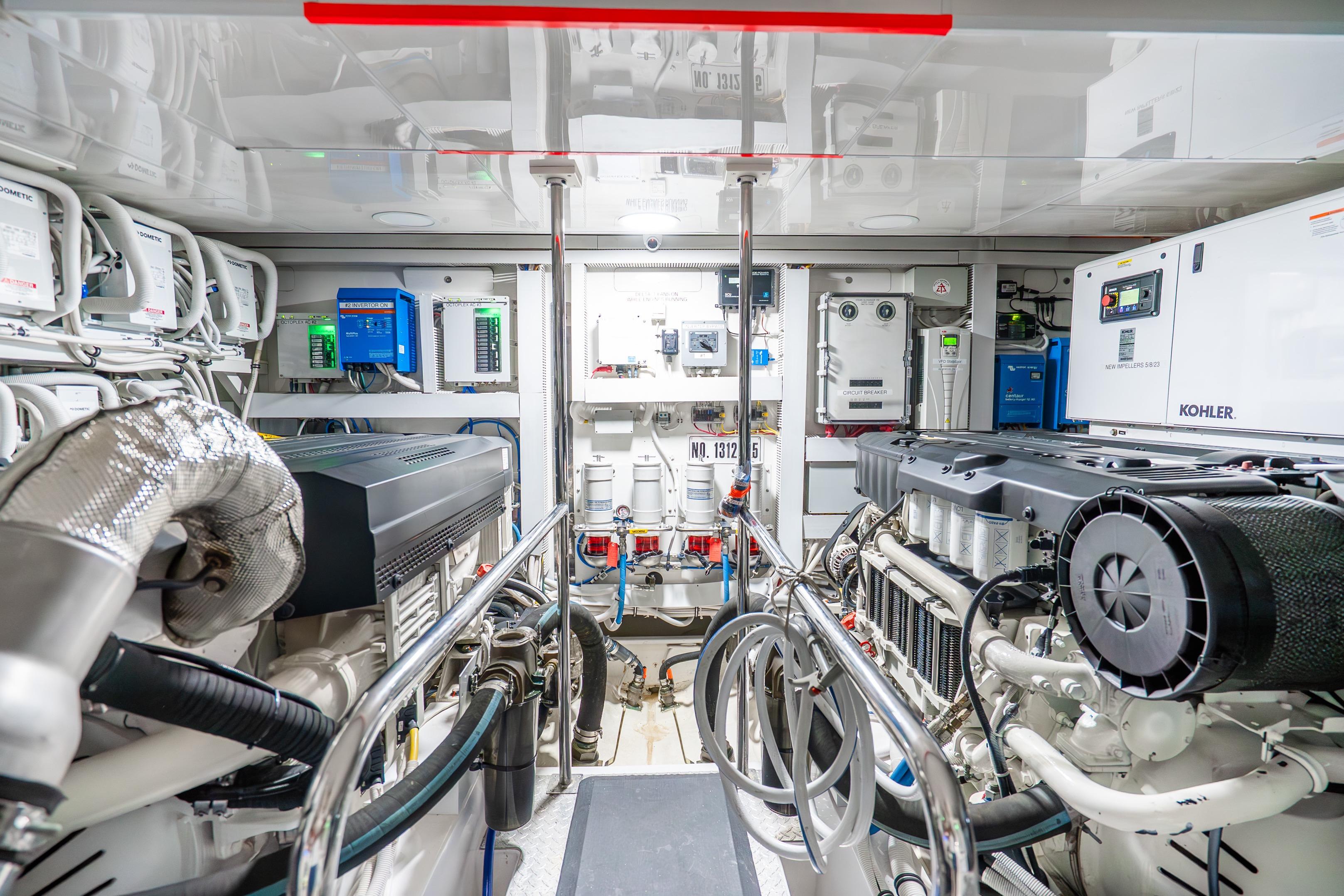 Engine room of 2021 Ocean Alexander 70E Motoryacht, featuring advanced machinery and equipment.