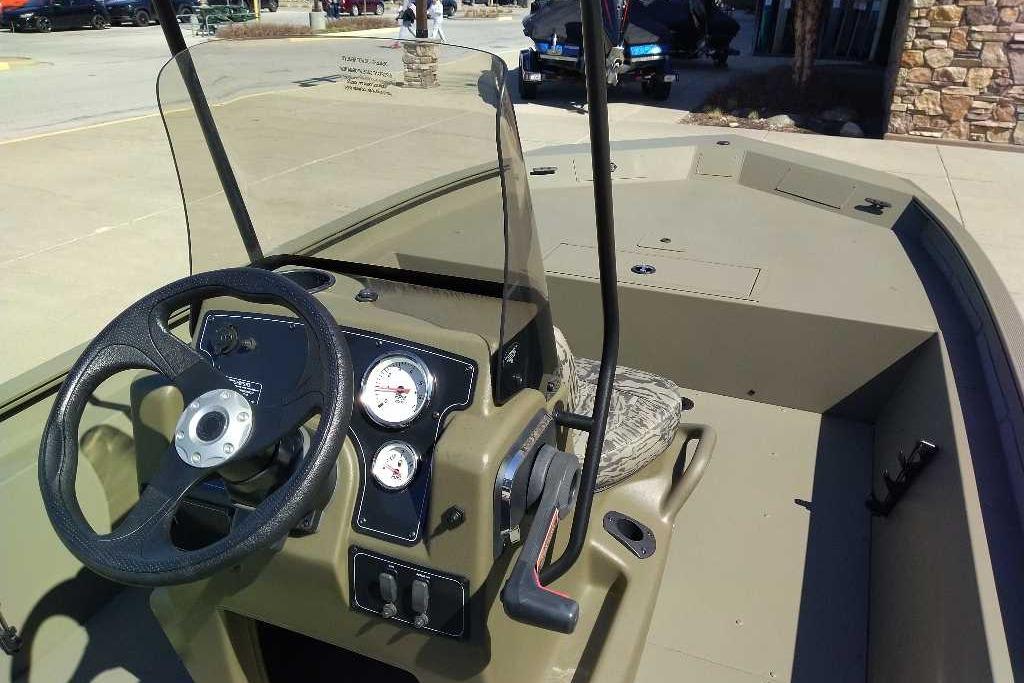 2026 Tracker Grizzly 1860 CC boat interior with steering wheel and gauges.