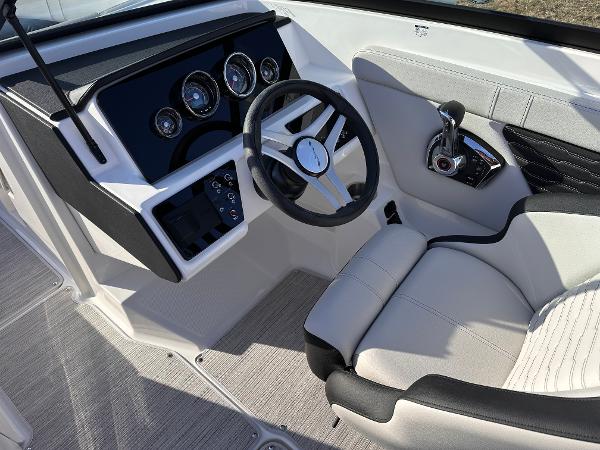 2025 Sea Ray SPX 230 OB boat cockpit with modern steering and controls.