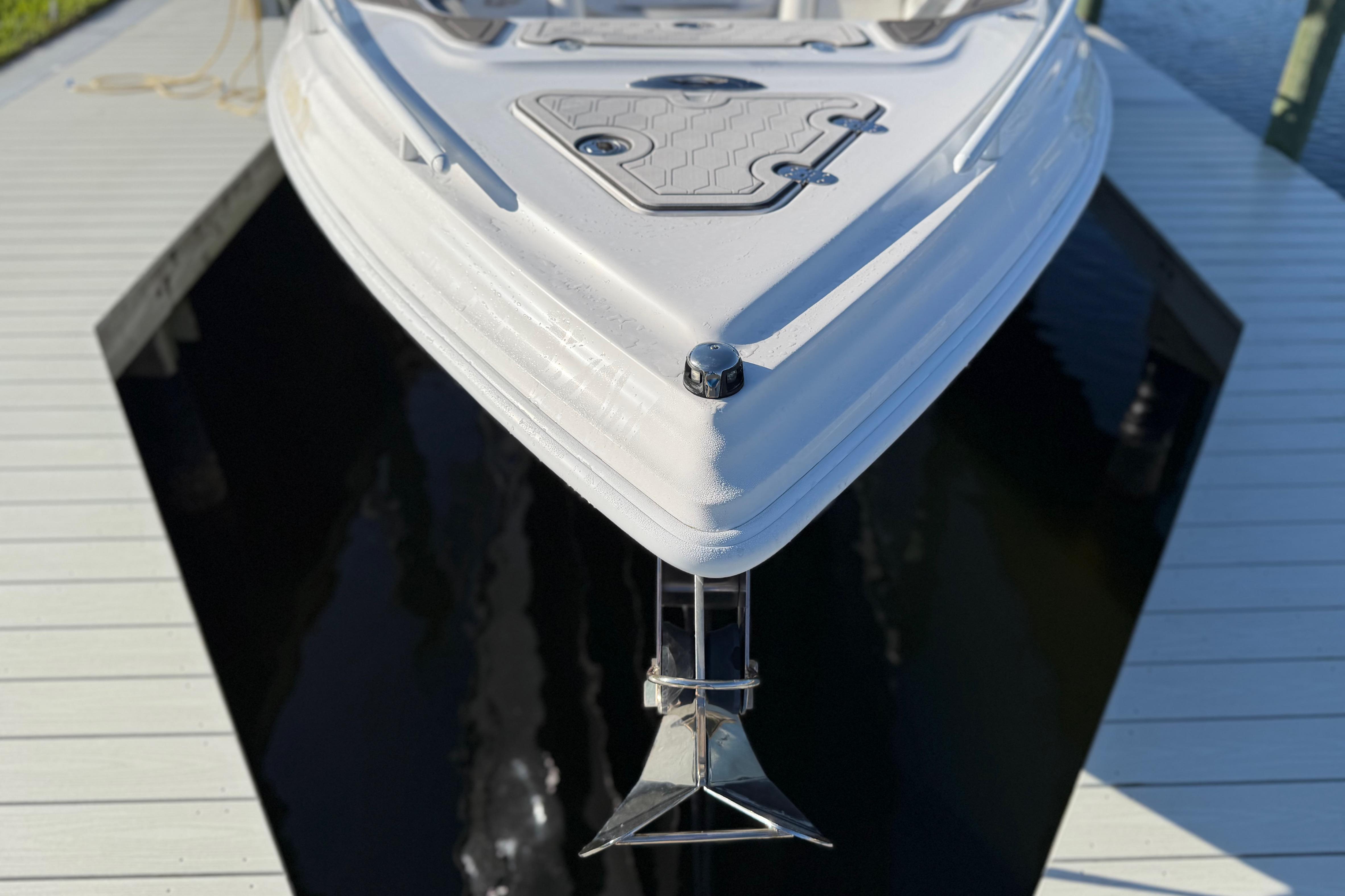 2022 Glasstream 328 Pro-XS boat docked, showcasing sleek bow design.