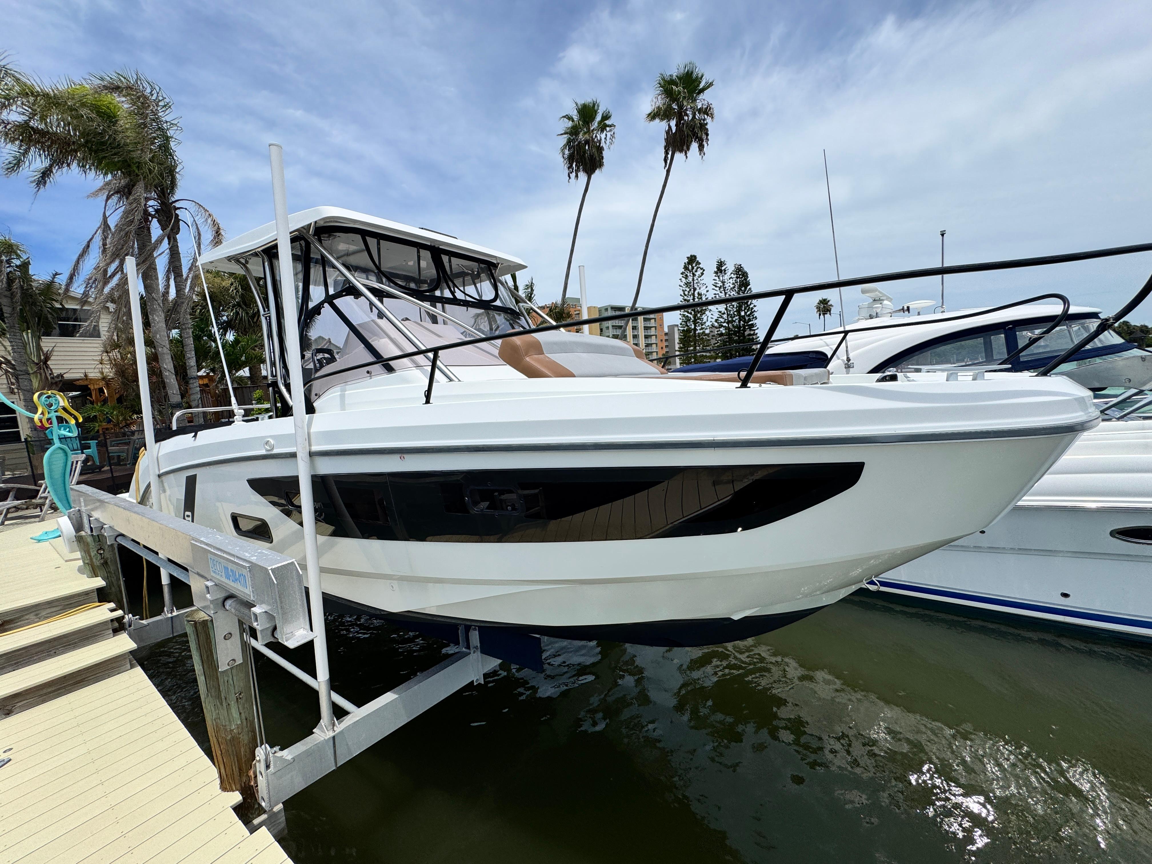 2022 Beneteau Flyer 9 SUNdeck boat docked, showcasing sleek design and modern features.
