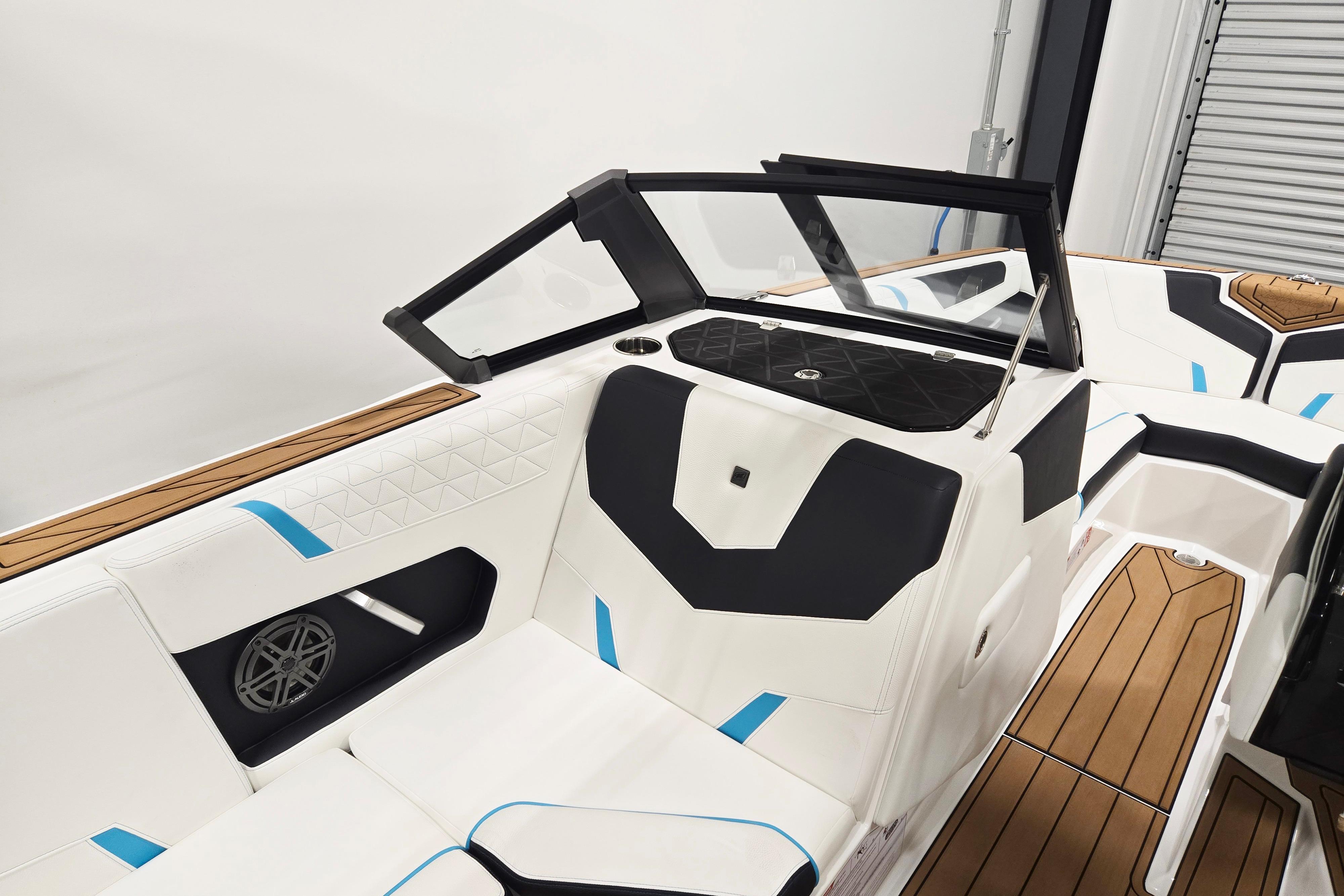 2026 Nautique Super Air Nautique GS22 interior with sleek white and black seating design.