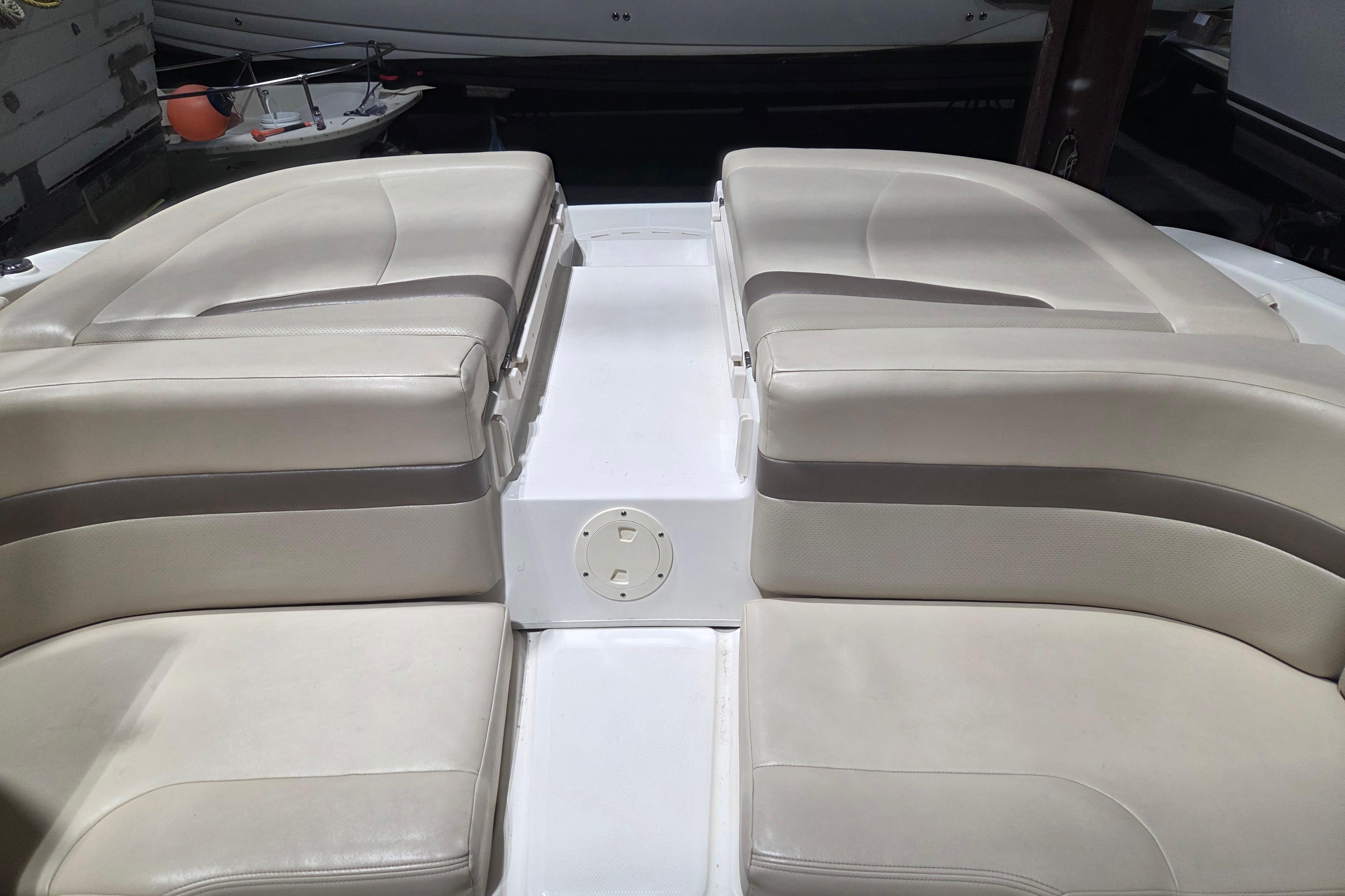 2006 Chaparral 236 SSi boat interior with beige seating and white accents.