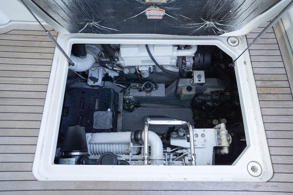 Engine compartment of 2005 Sea Ray 48 Sundancer yacht, showcasing mechanical components.